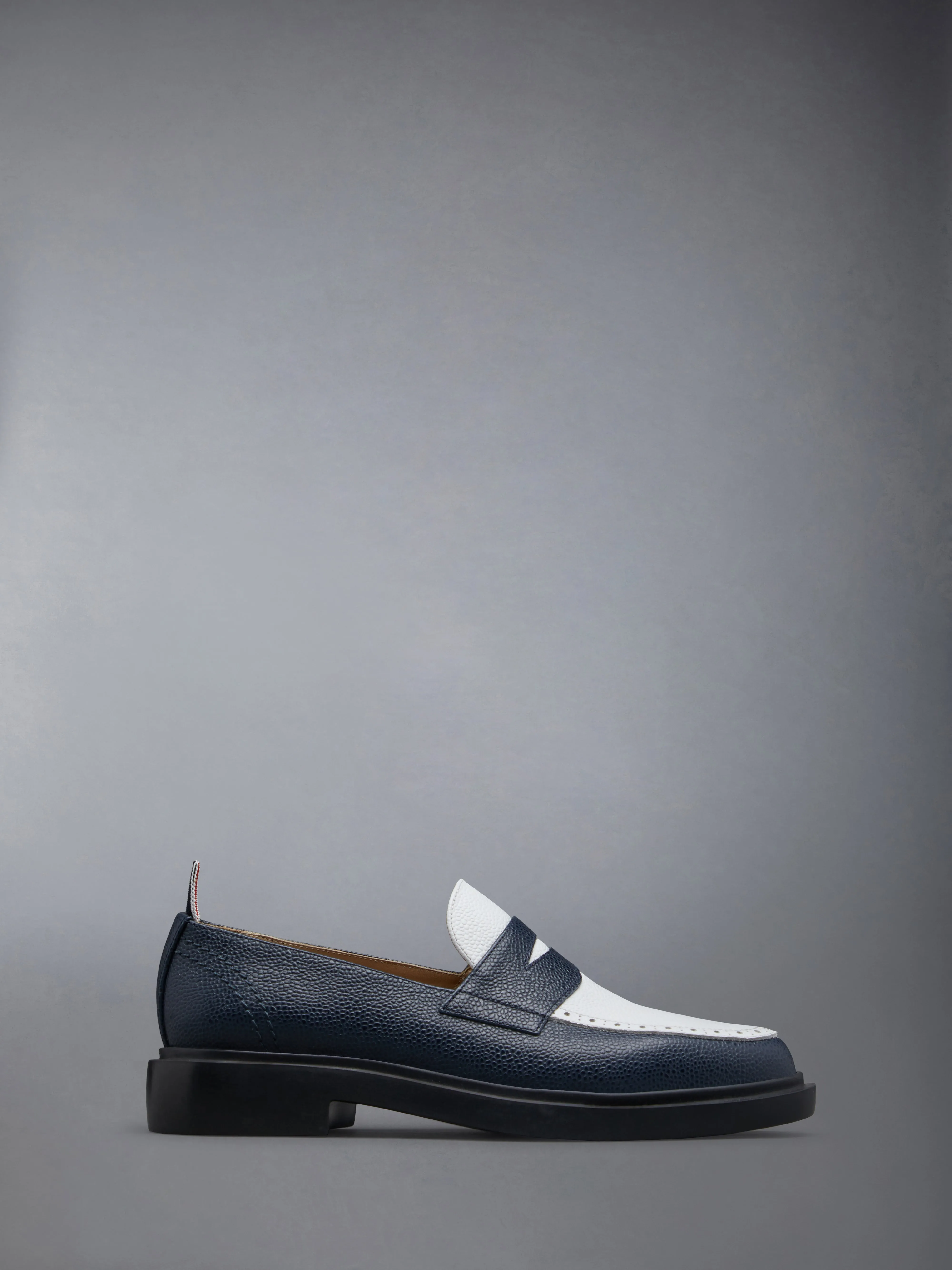 Pebble Grain Leather Penny Loafer sold by Thom Browne