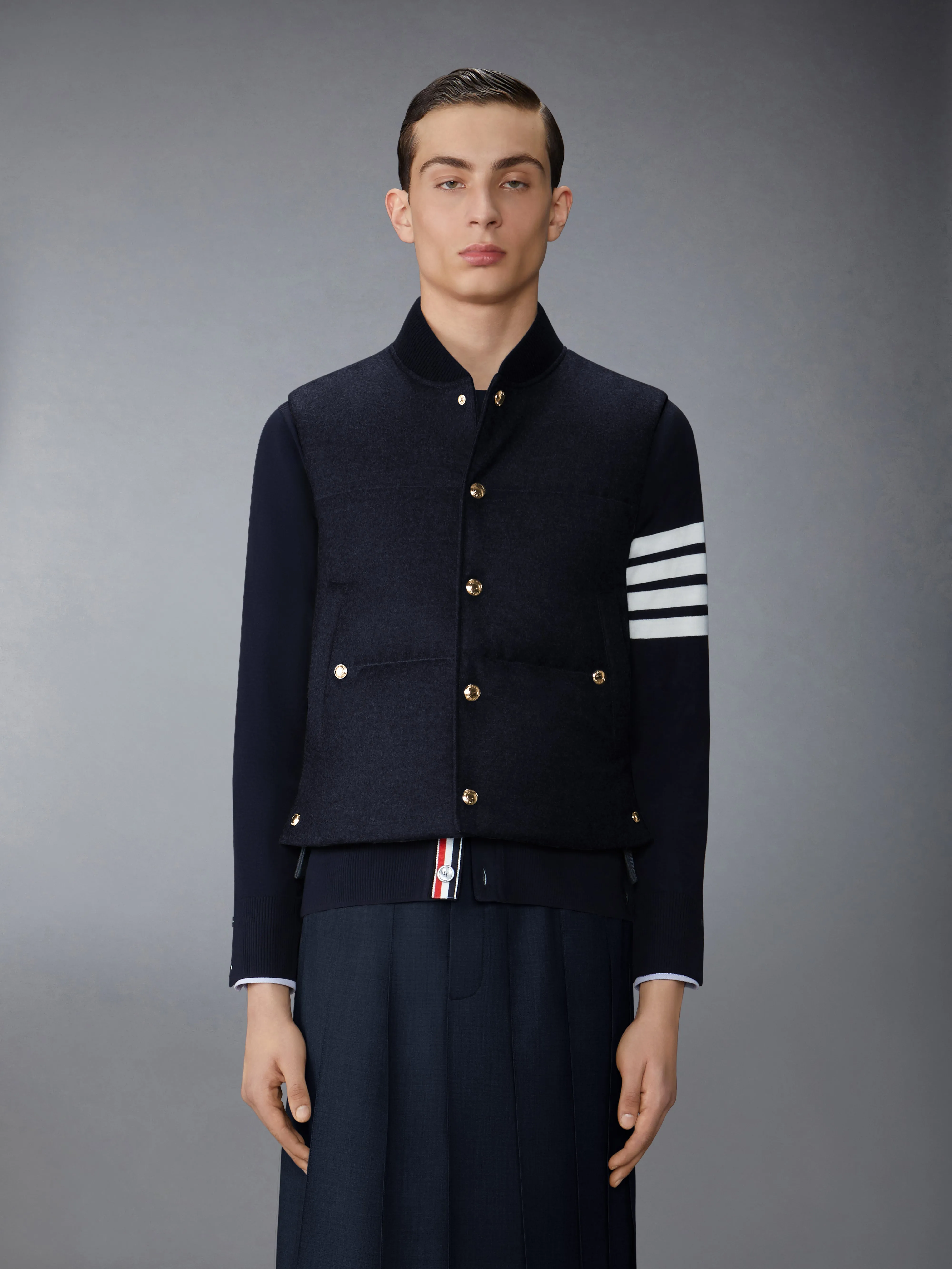 DOWNFILLED SNAP FRONT VEST W/ TONAL GROSGRAIN IN WOOL FLANNEL sold by Thom Browne