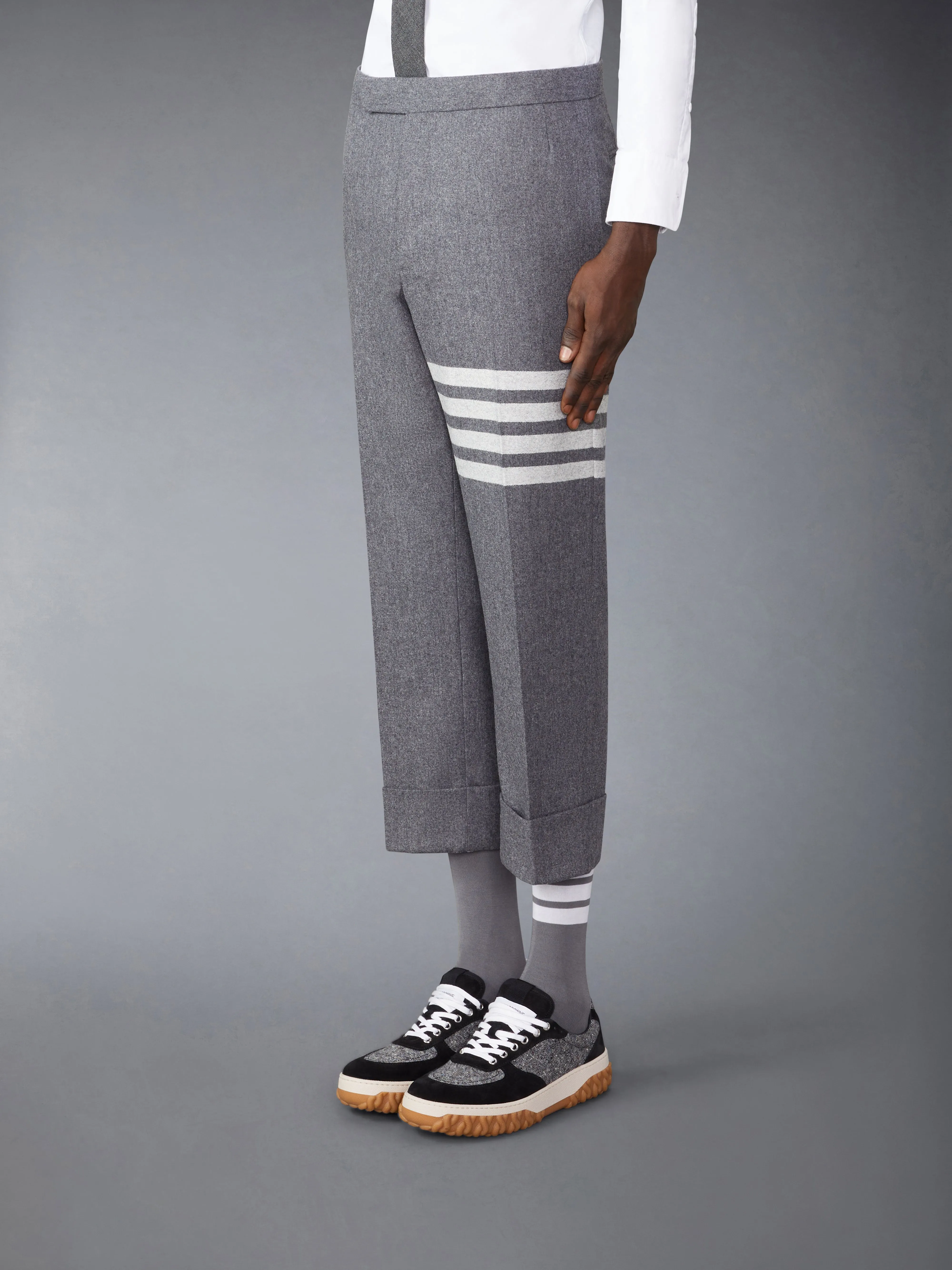 FLANNEL 4-BAR LOW RISE BACKSTRAP TROUSERS sold by Thom Browne product image thumbnail 3