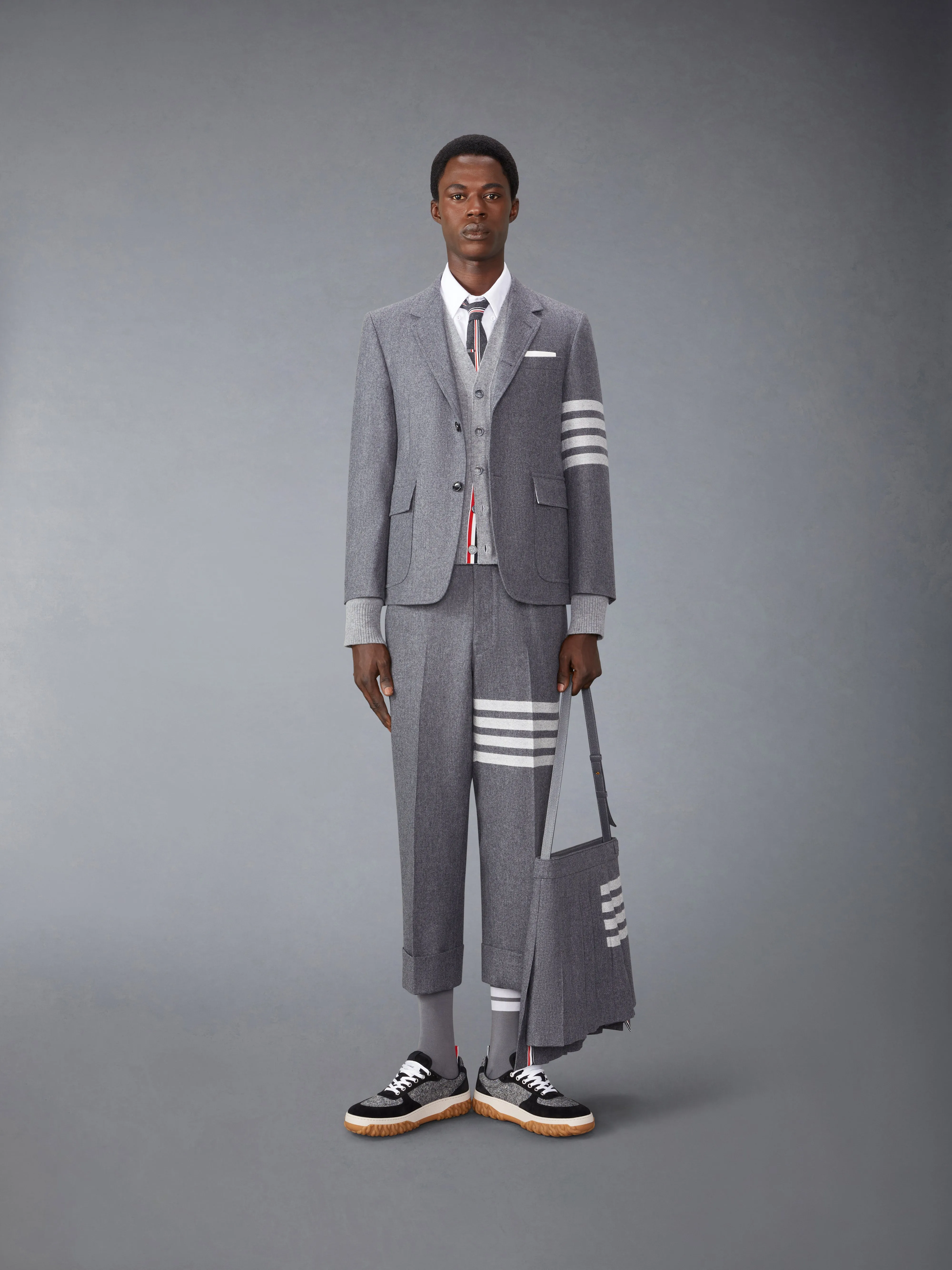 FLANNEL 4-BAR LOW RISE BACKSTRAP TROUSERS sold by Thom Browne product image thumbnail 4