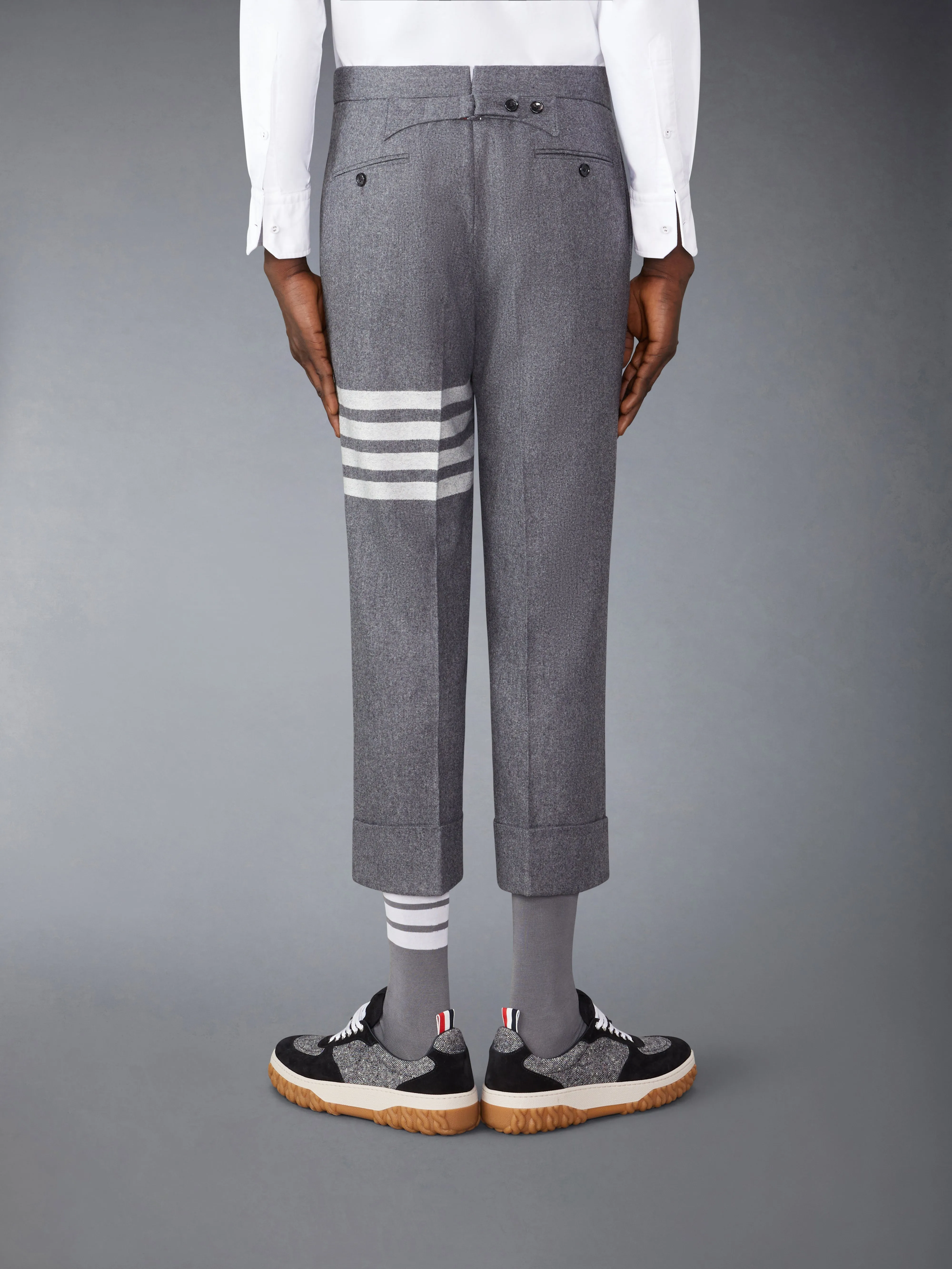 FLANNEL 4-BAR LOW RISE BACKSTRAP TROUSERS sold by Thom Browne product image thumbnail 2