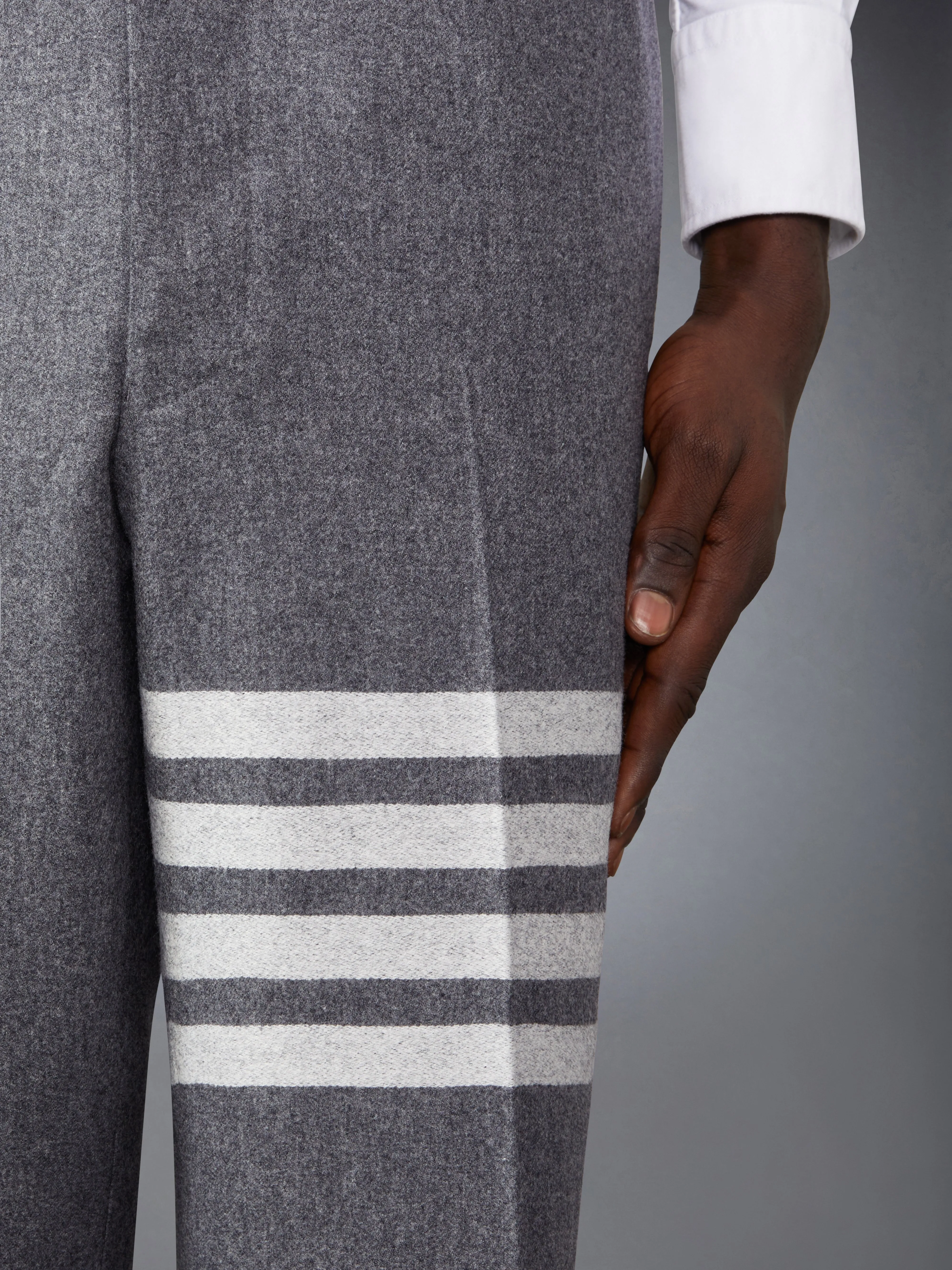 FLANNEL 4-BAR LOW RISE BACKSTRAP TROUSERS sold by Thom Browne product image thumbnail 5