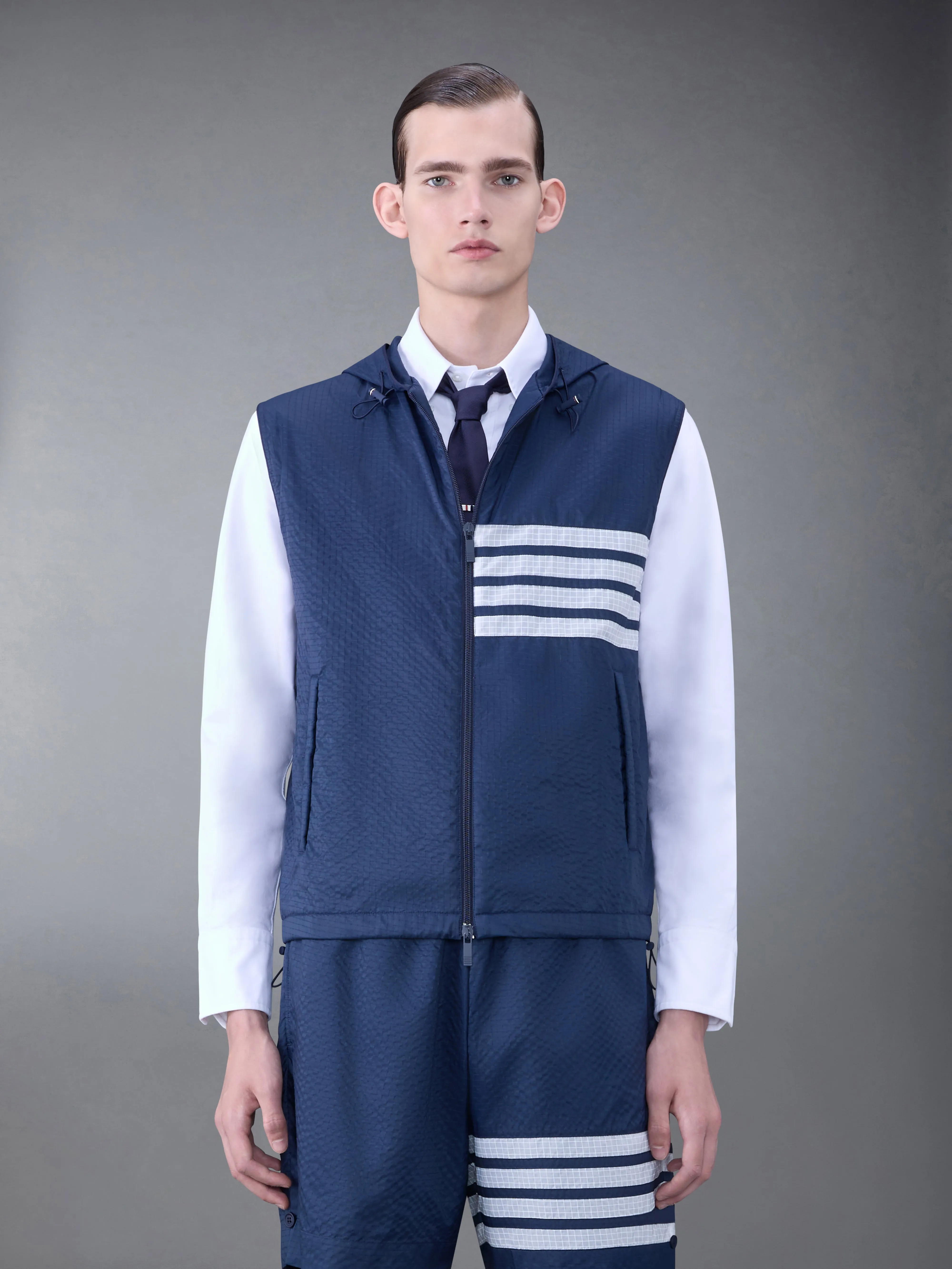 ULTRALIGHT RIPSTOP 4-BAR HOODED VEST sold by Thom Browne