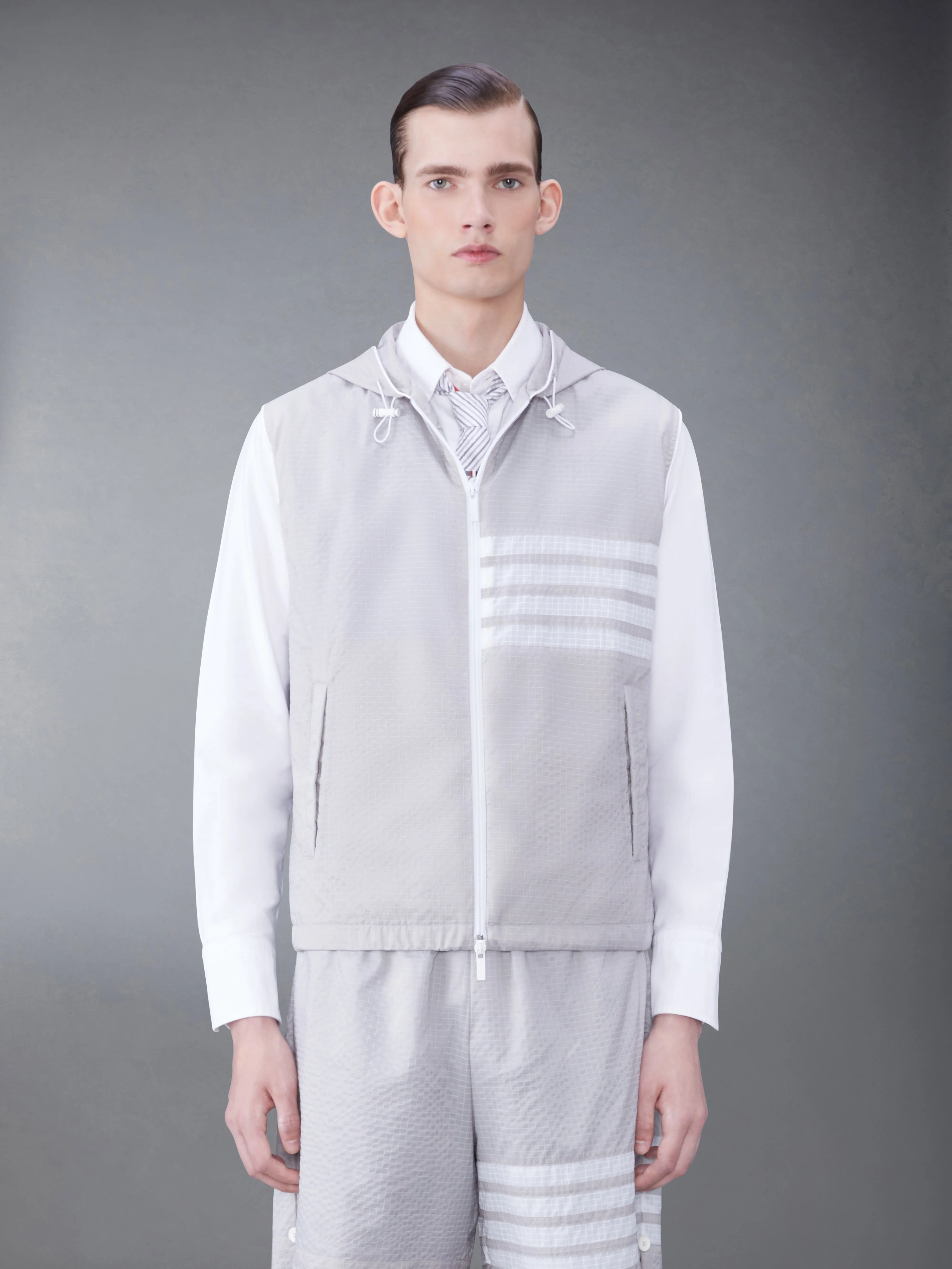 ULTRALIGHT RIPSTOP 4-BAR HOODED VEST sold by Thom Browne