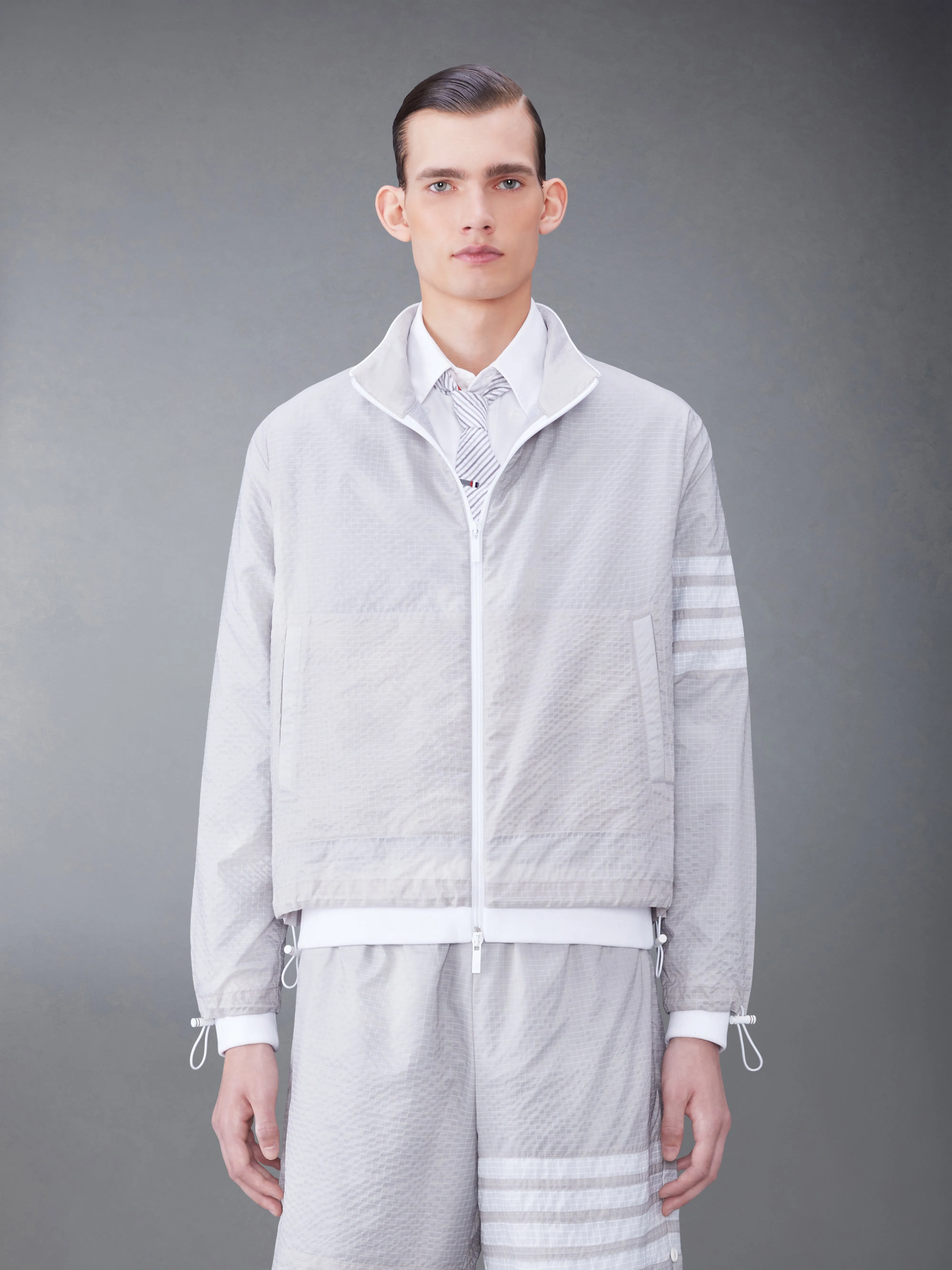 ULTRALIGHT RIPSTOP 4-BAR FUNNEL NECK JACKET sold by Thom Browne