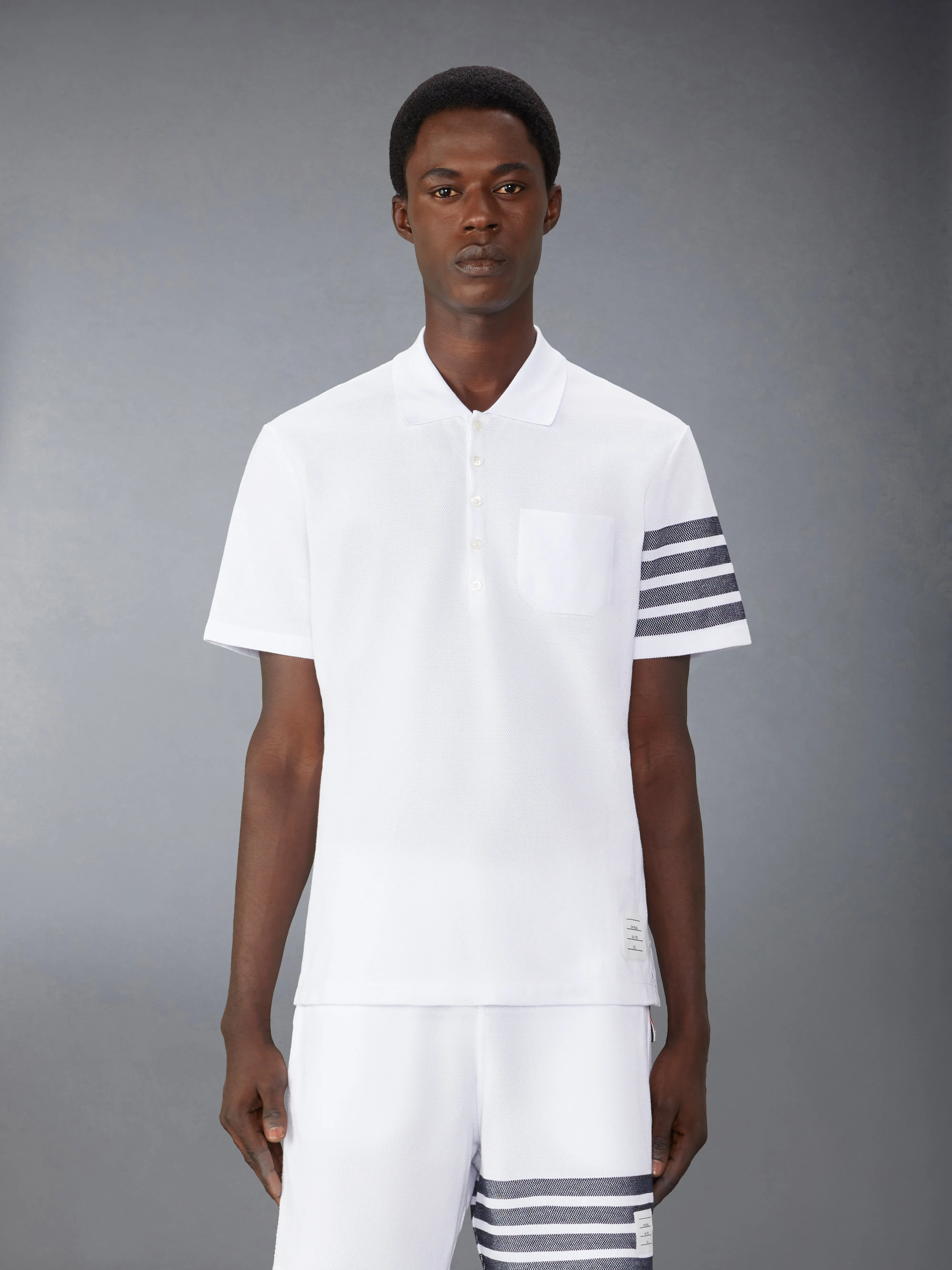 COTTON PIQUE 4-BAR POLO sold by Thom Browne