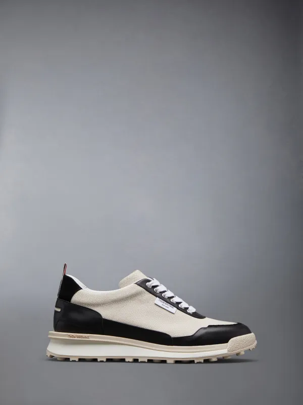 COTTON CANVAS ALUMNI TRAINER sold by Thom Browne