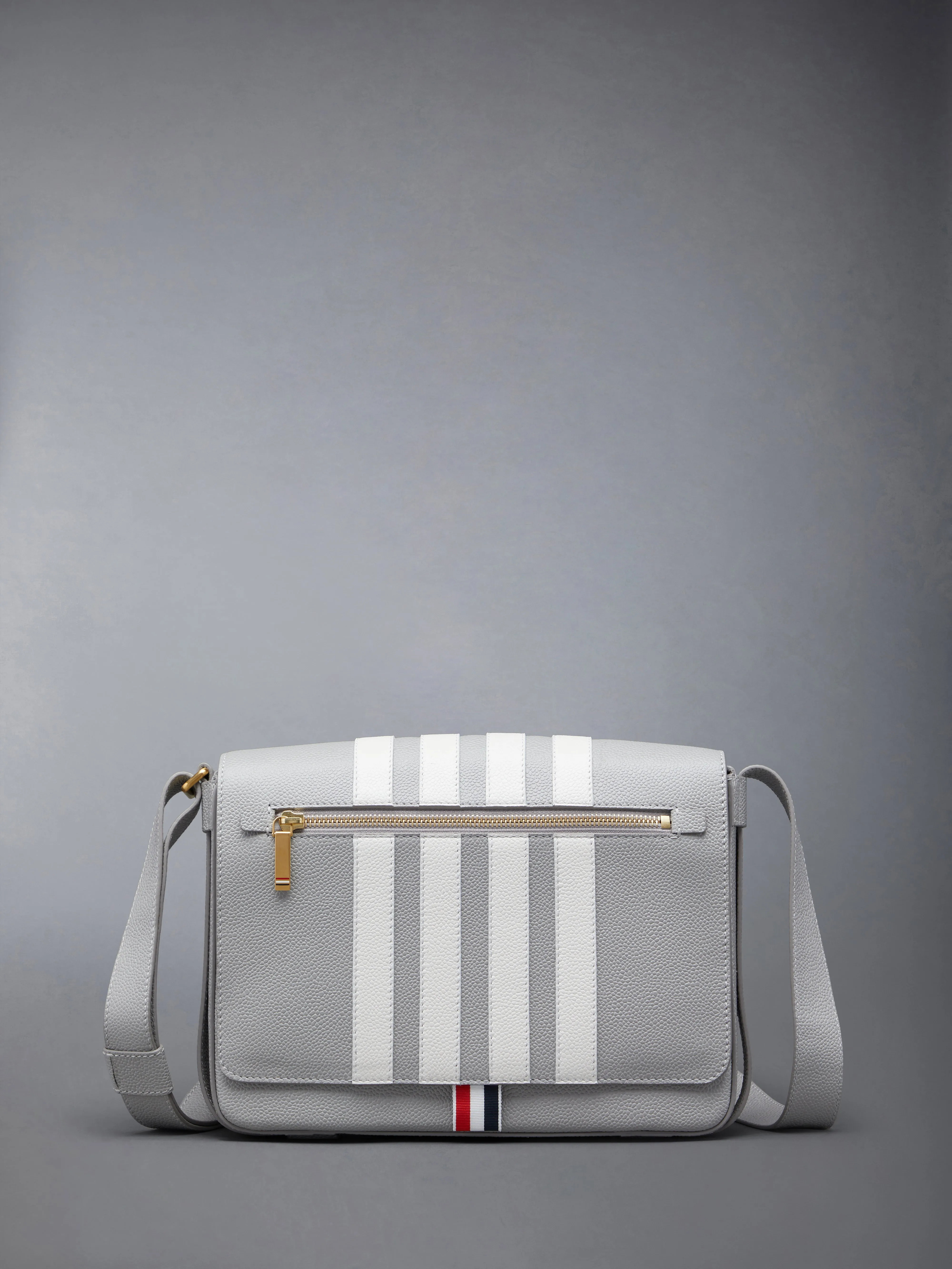 PEBBLE GRAIN 4-BAR REPORTER BAG sold by Thom Browne