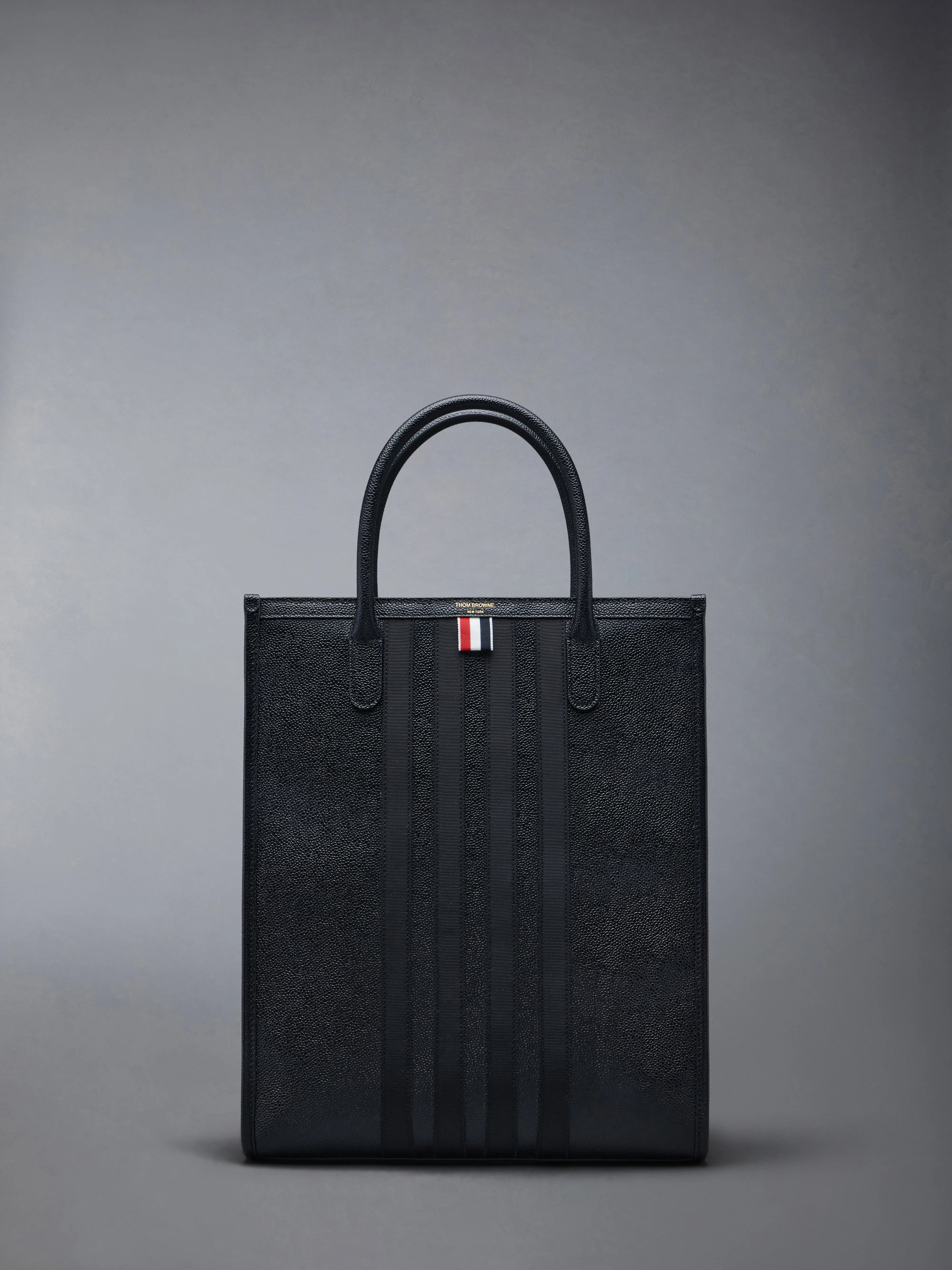 PEBBLE GRAIN 4-BAR TOTE sold by Thom Browne