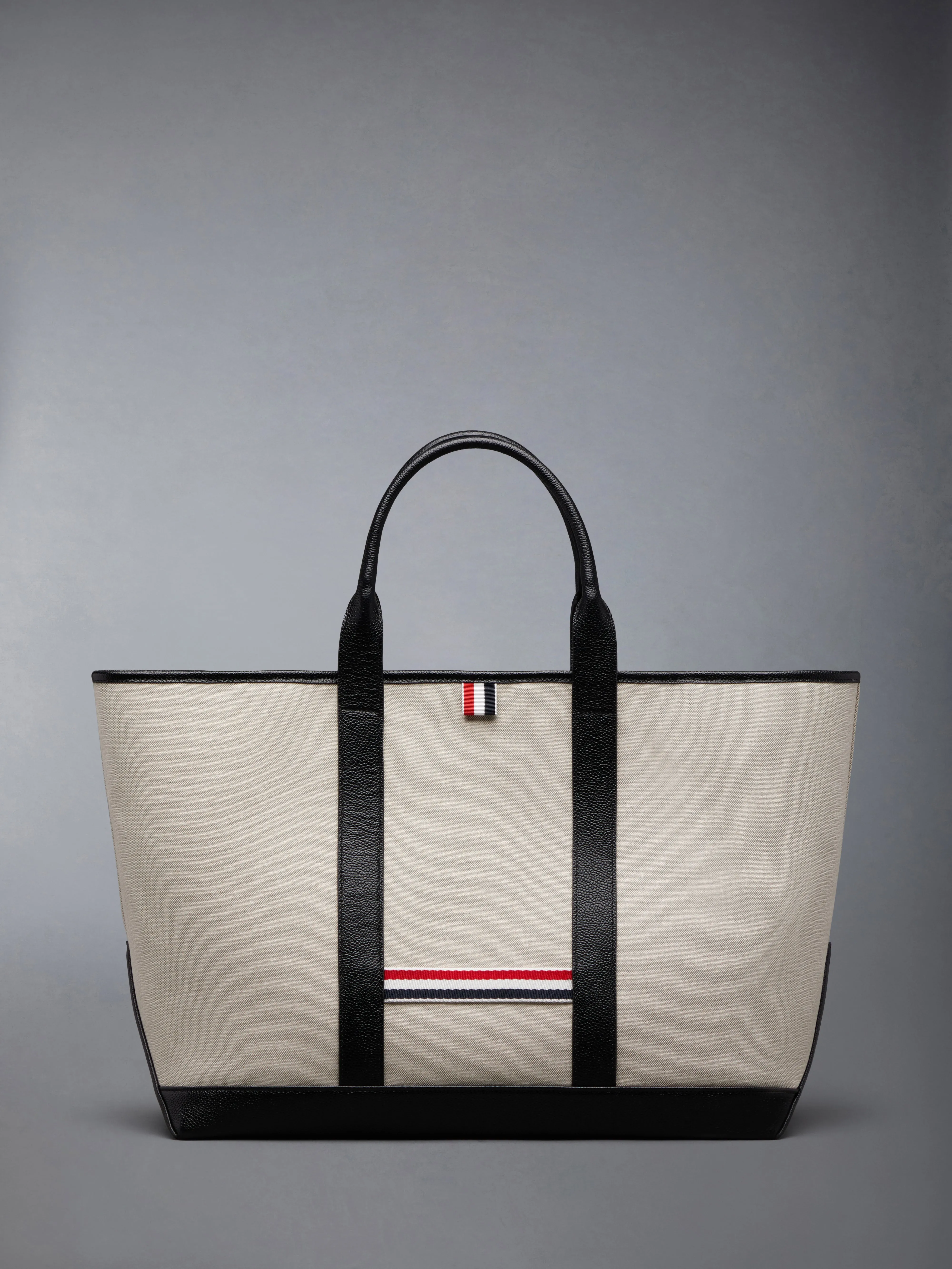 COTTON CANVAS LEATHER MEDIUM TOOL TOTE sold by Thom Browne