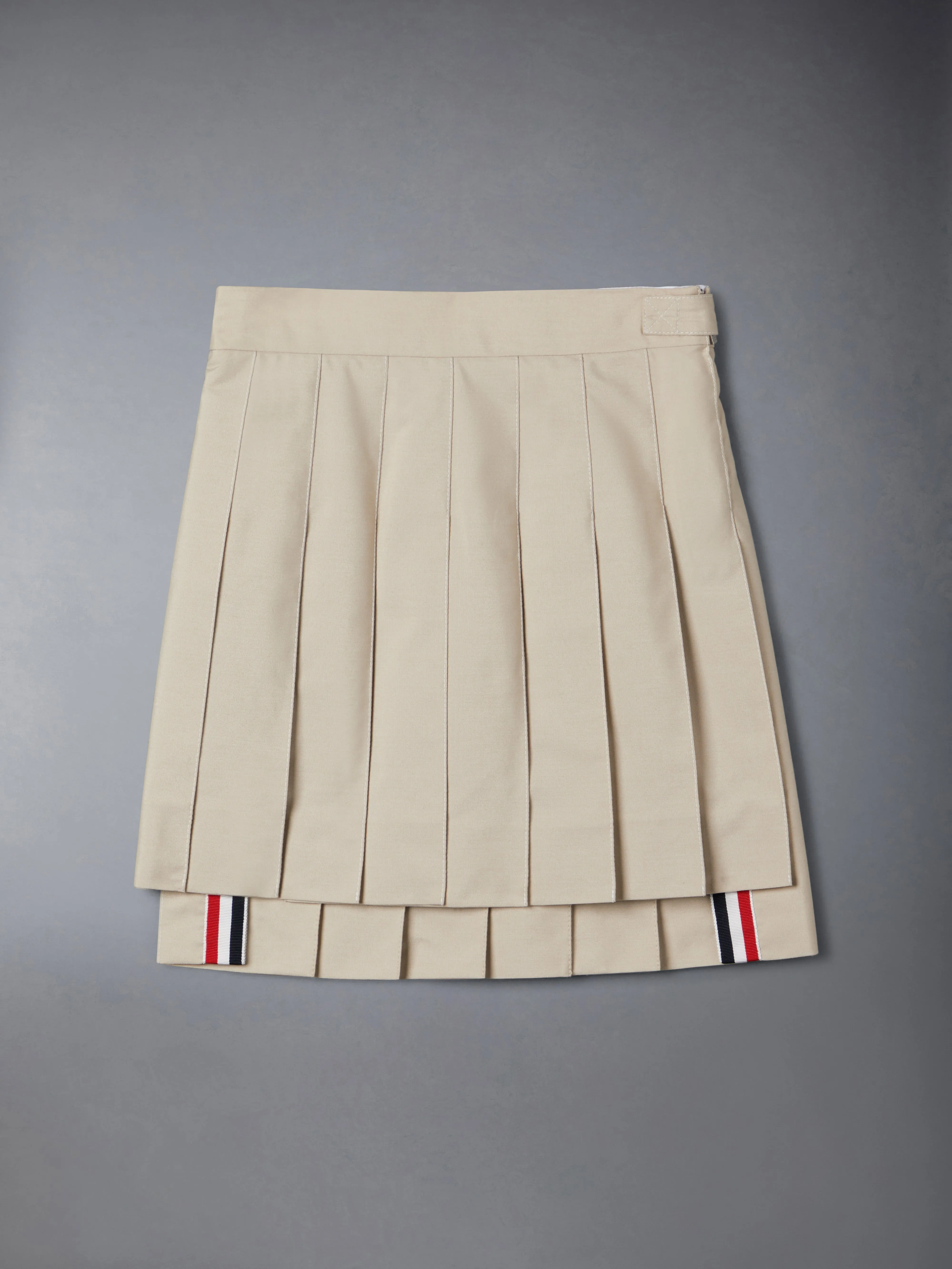 TYPEWRITER PLEATED MINI SKIRT sold by Thom Browne