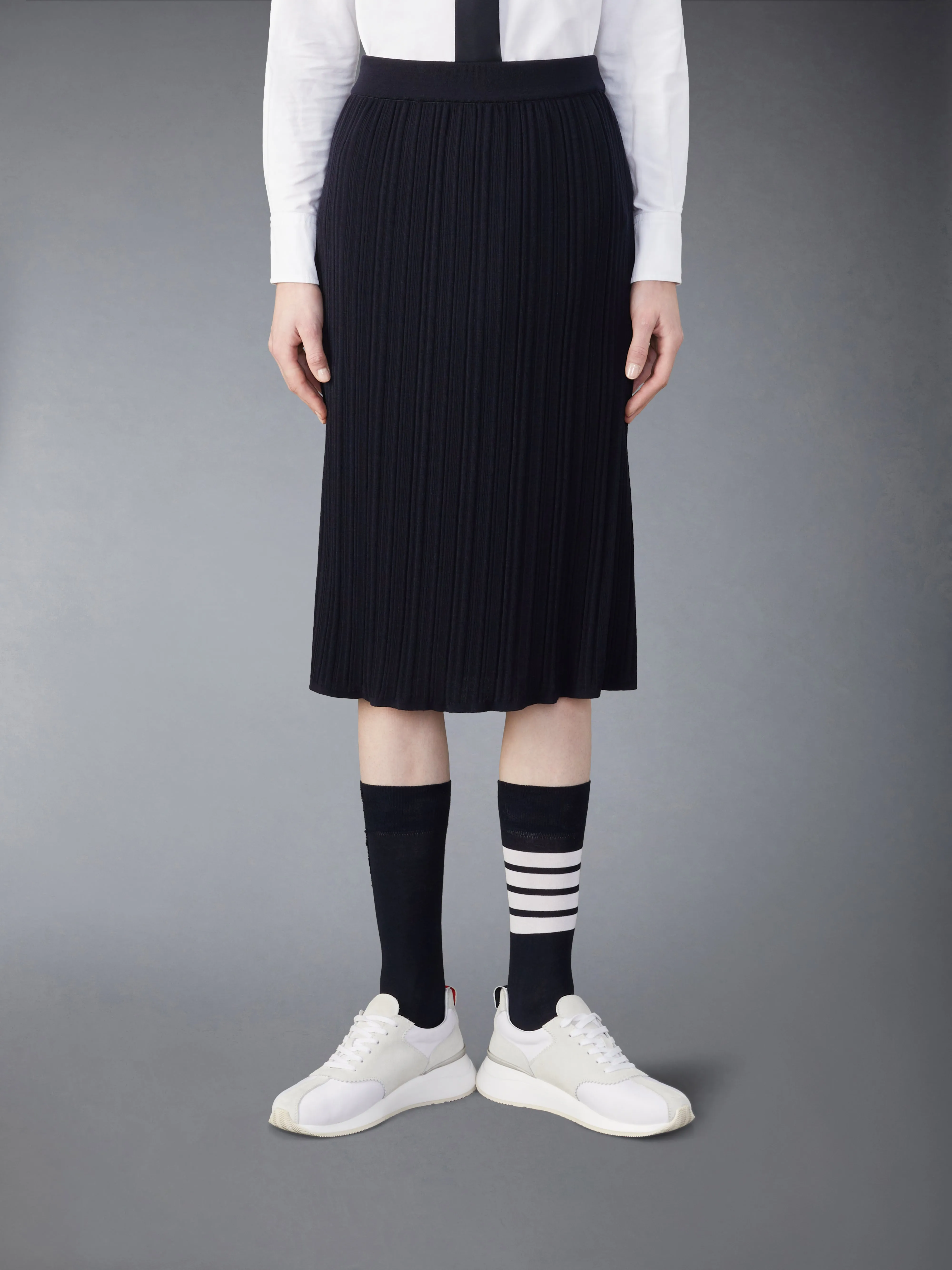 WOOL CREPE RIB STITCH MIDI PLISSE SKIRT sold by Thom Browne