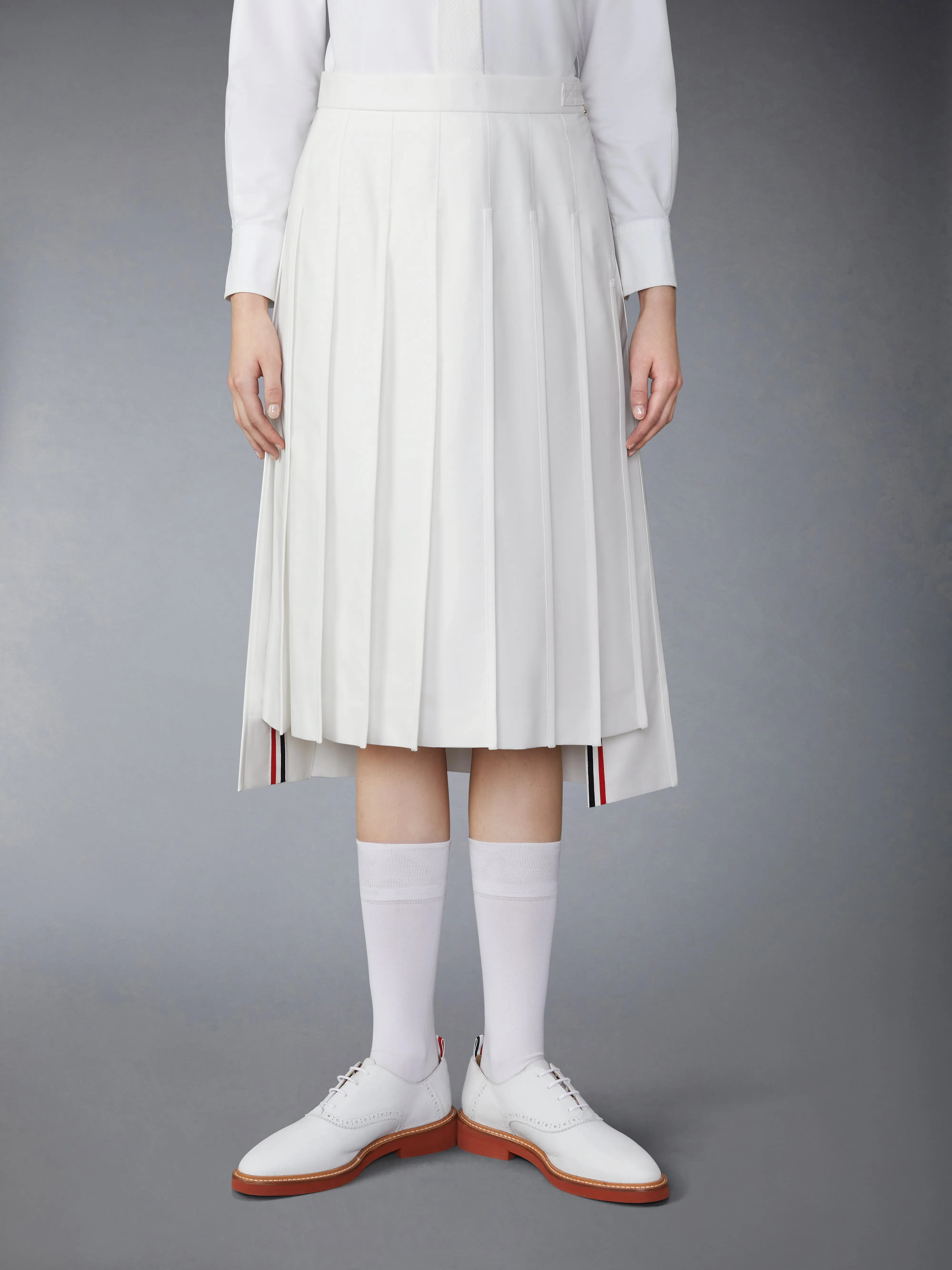 TYPEWRITER SELF TIPPING MIDI PLEATED SKIRT sold by Thom Browne