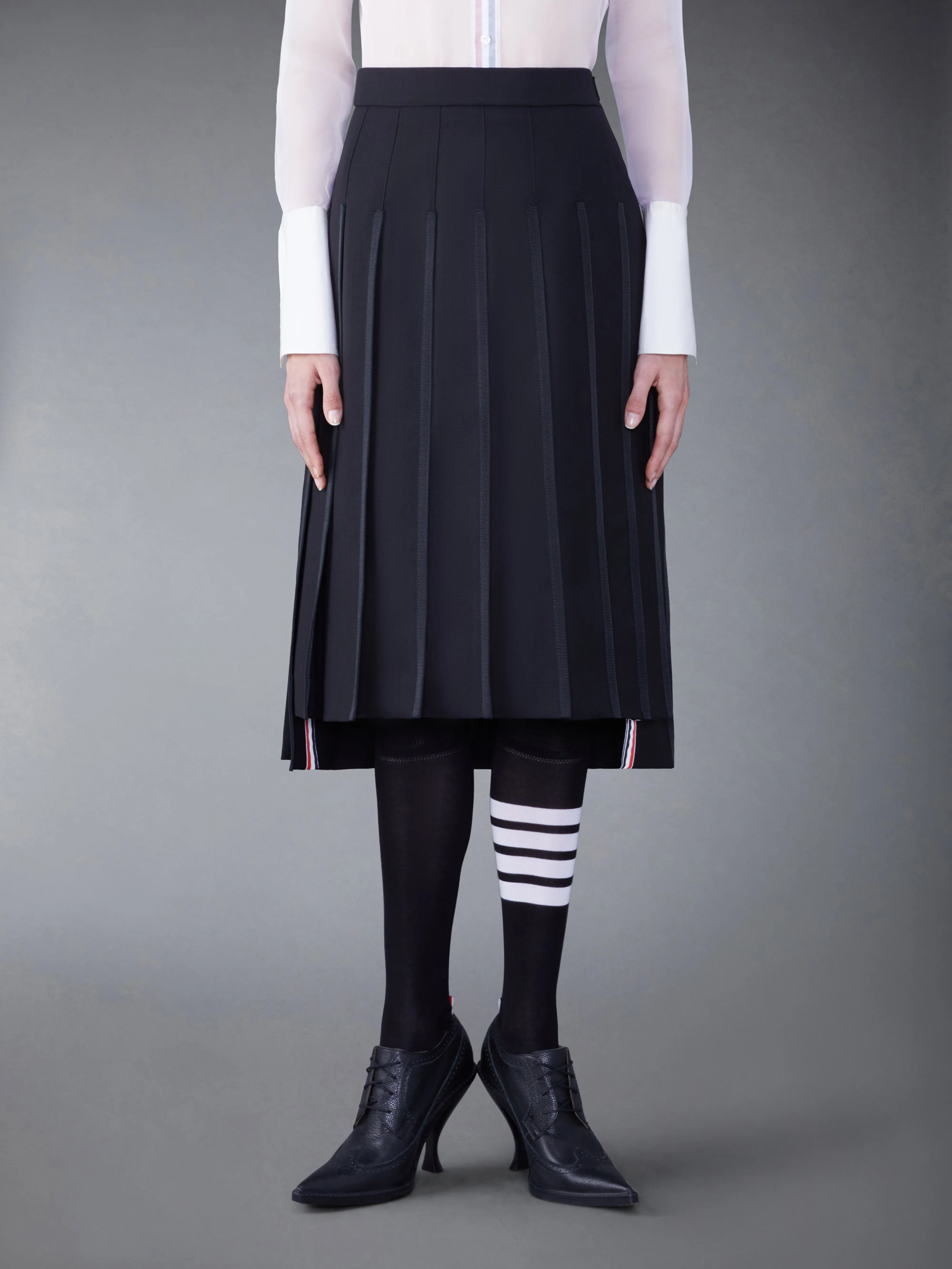 CLASSIC TIPPING PLEATED SKIRT sold by Thom Browne