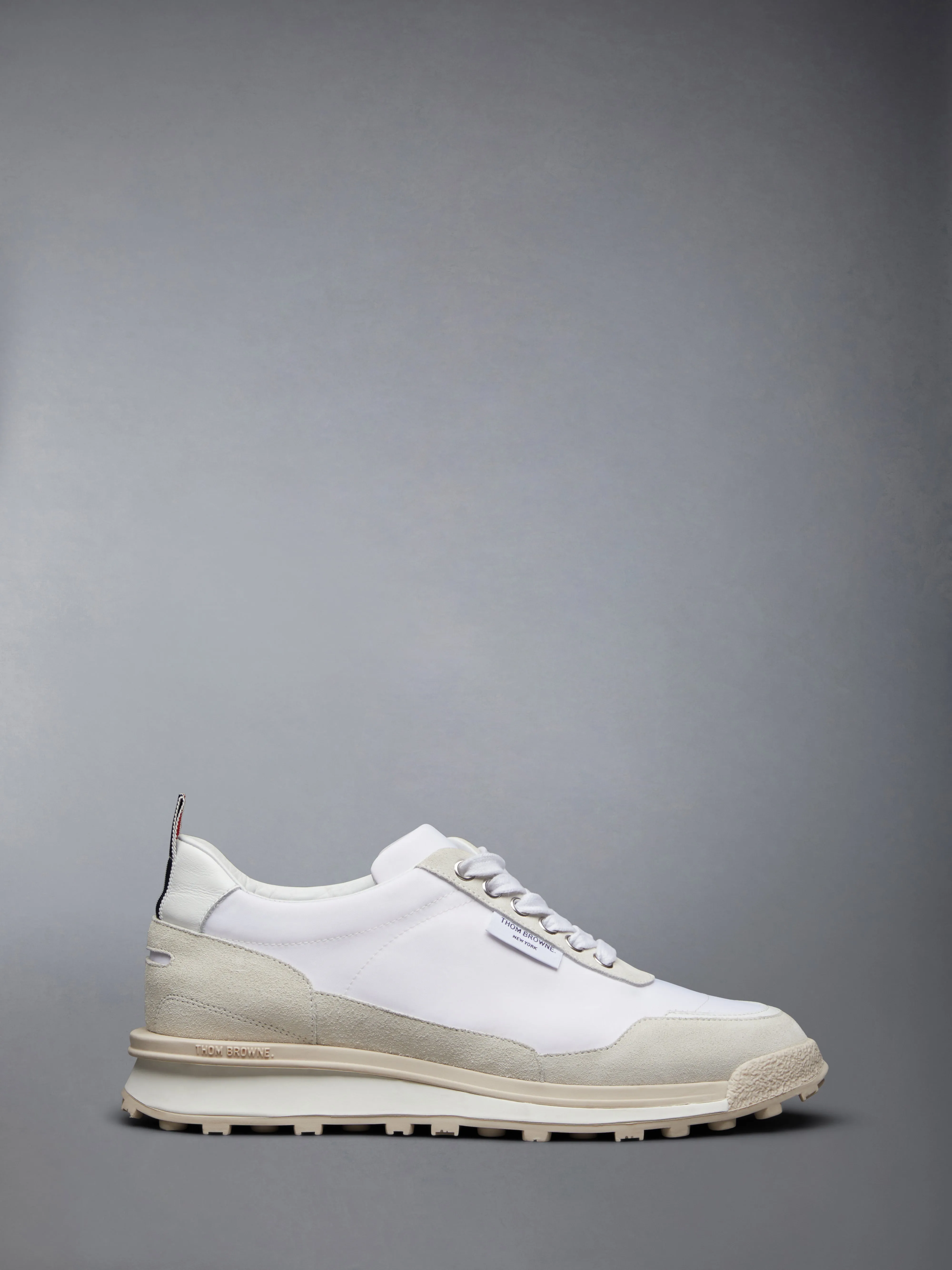 ECO NYLON ALUMNI TRAINER sold by Thom Browne