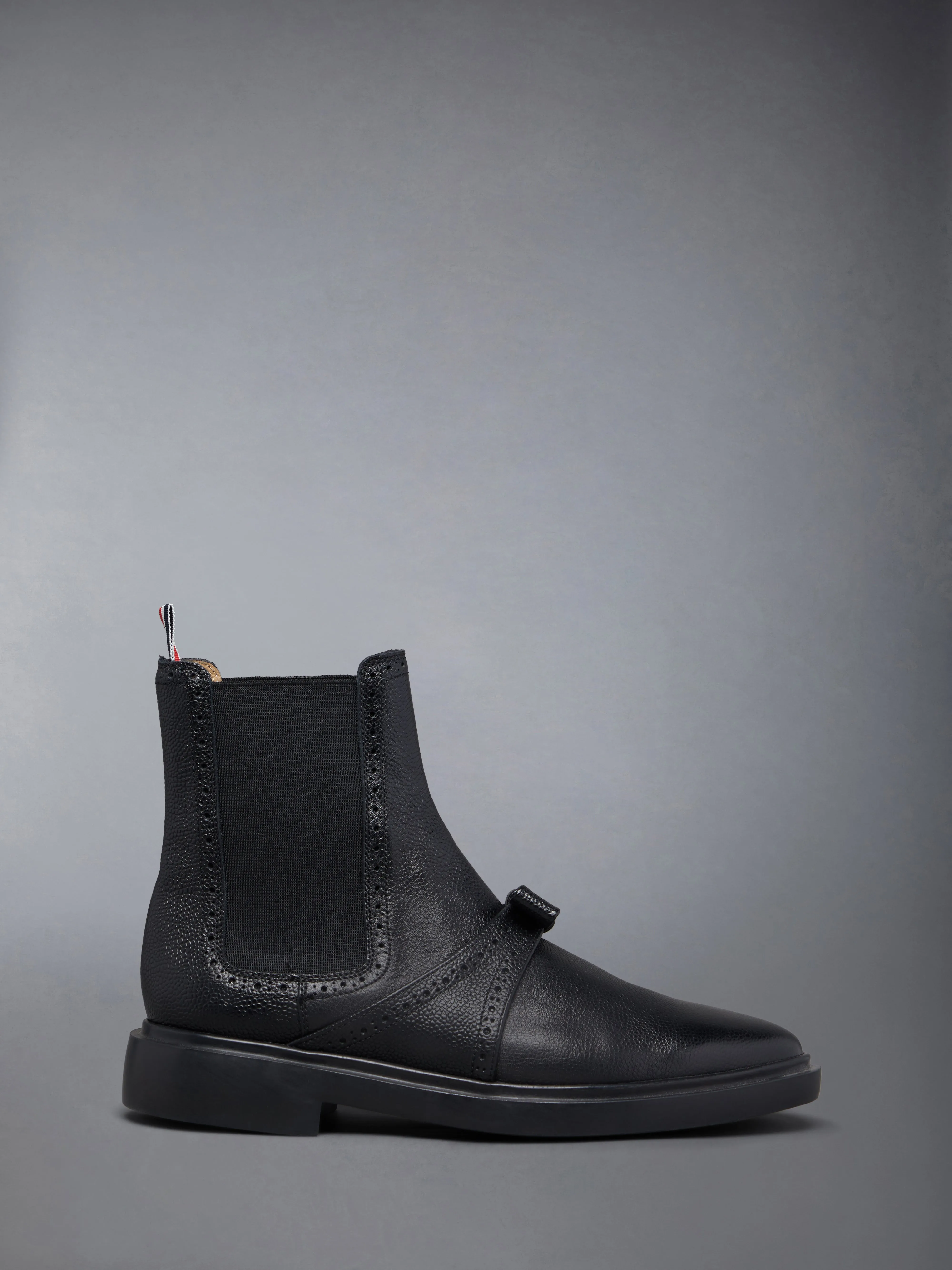 PEBBLE GRAIN LIGHTWEIGHT RUBBER SOLE BROGUED BOW CHELSEA BOOTS sold by Thom Browne