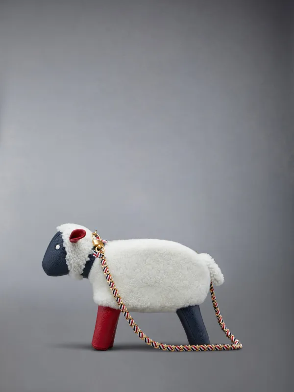 SMALL SHEEP CHAIN BAG IN SHEARLING & PEBBLE GRAIN sold by Thom Browne