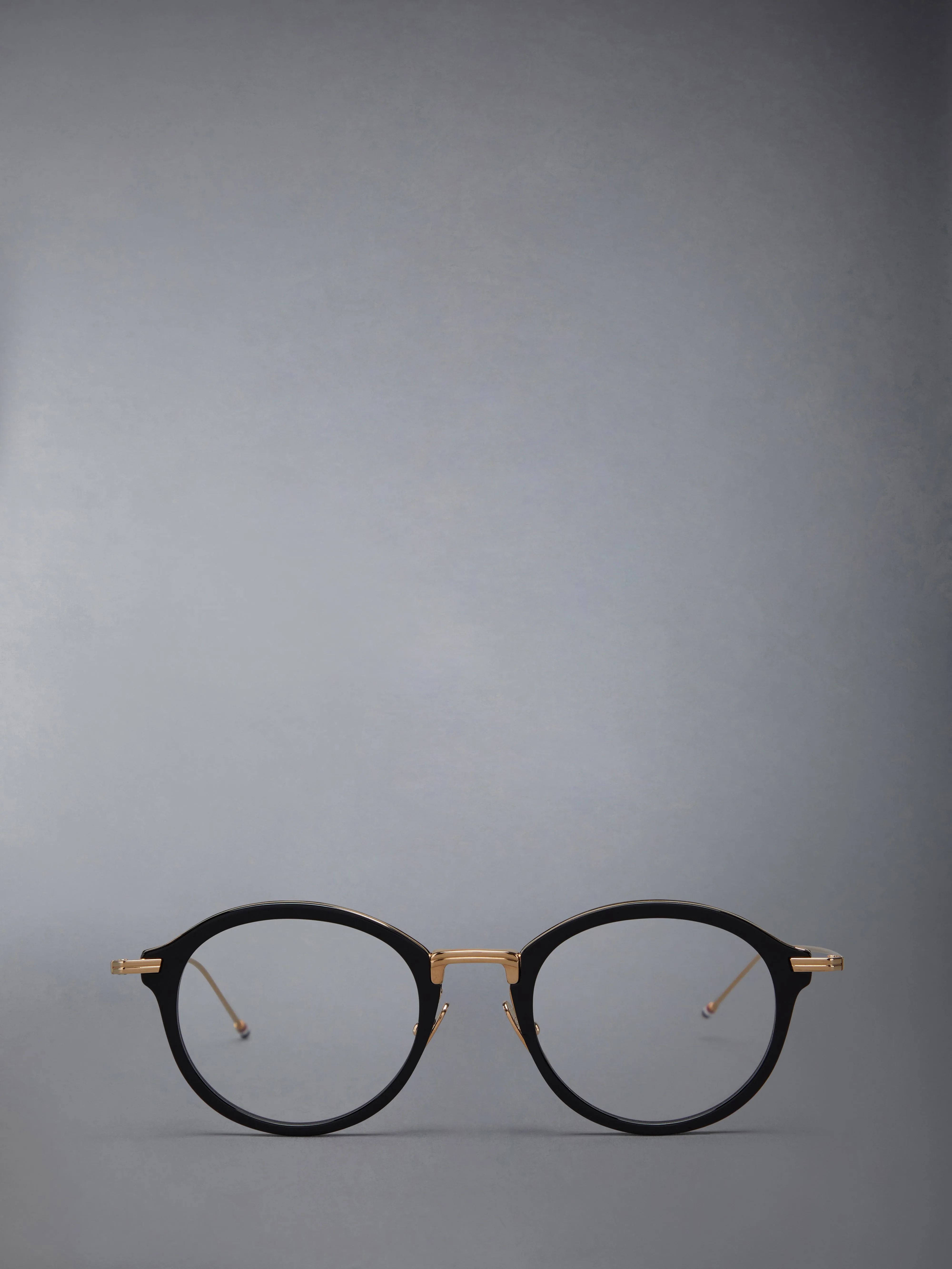ACETATE AND TITANIUM ROUND EYEGLASSES sold by Thom Browne