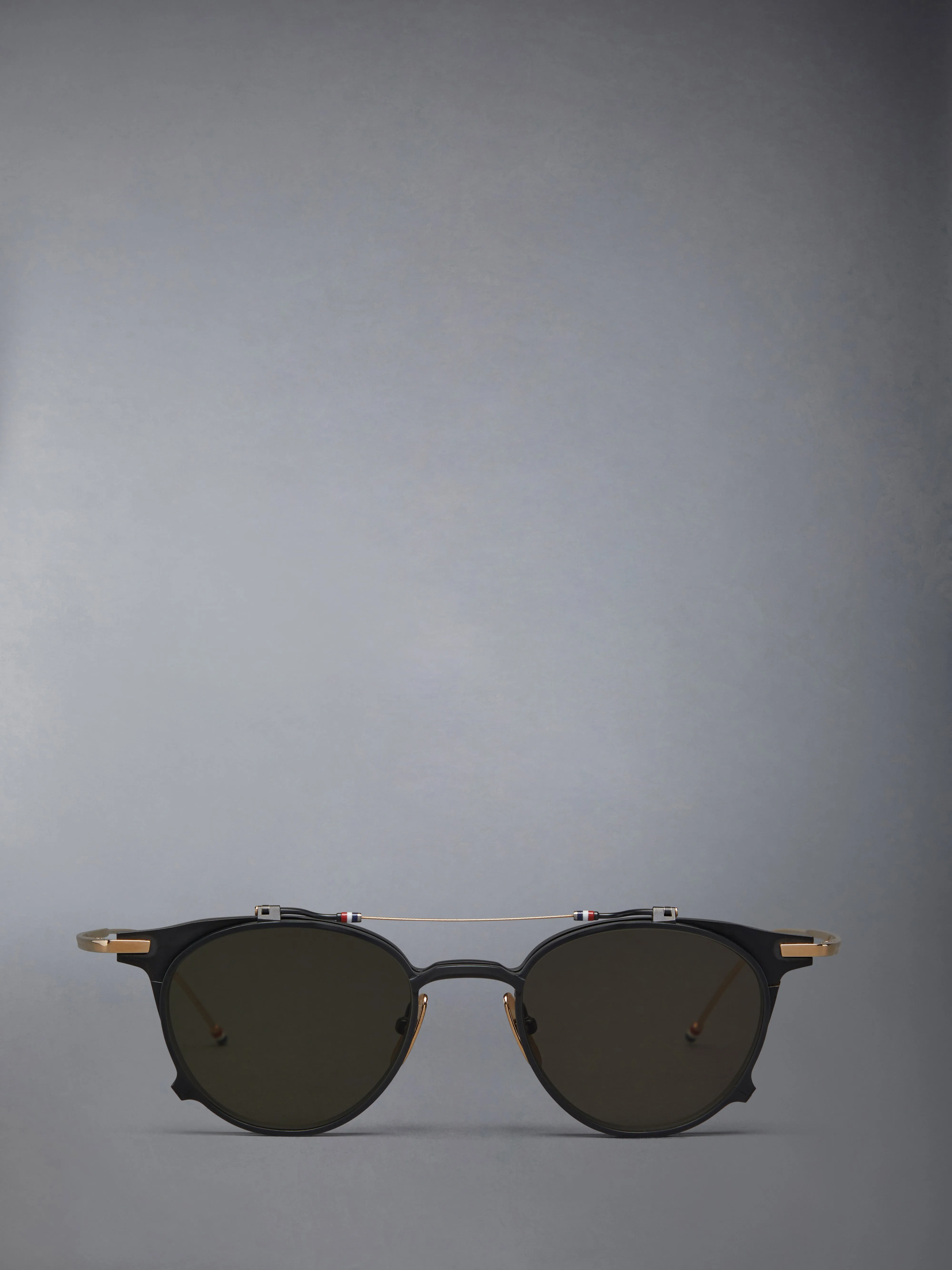 TITANIUM ROUND CLIP ON SUNGLASSES sold by Thom Browne