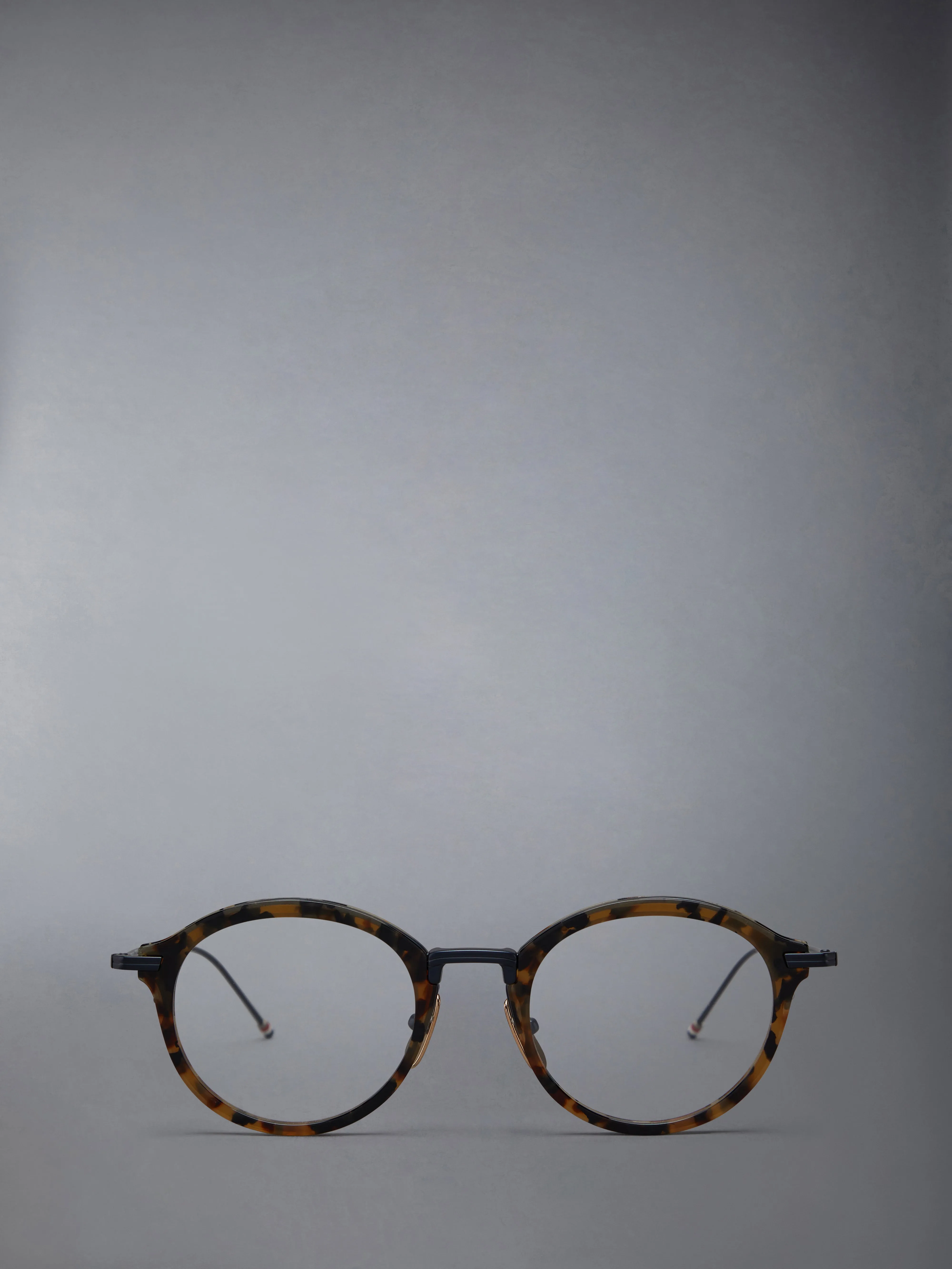 ACETATE AND TITANIUM ROUND EYEGLASSES sold by Thom Browne