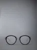 ACETATE AND TITANIUM ROUND EYEGLASSES sold by Thom Browne