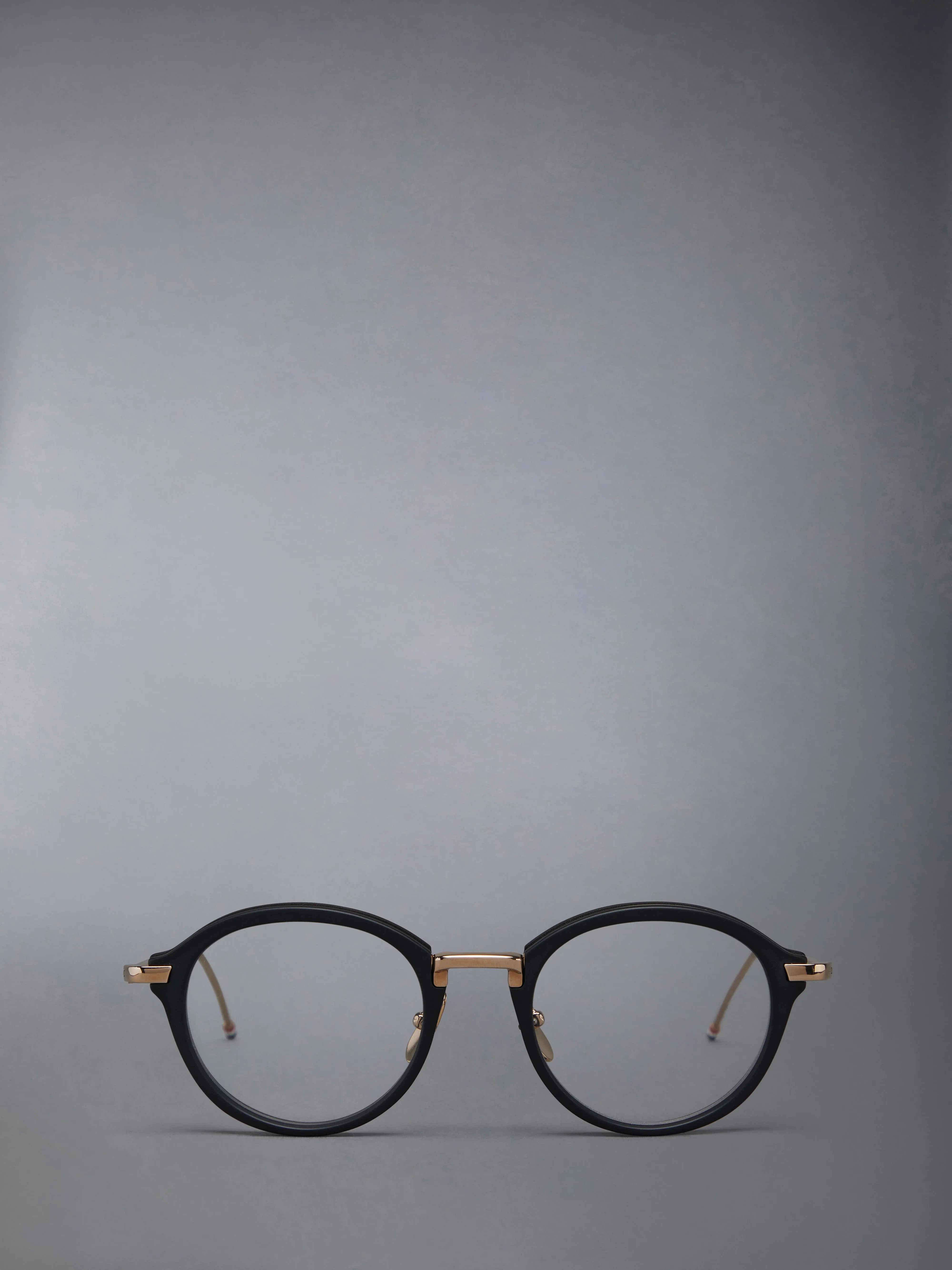 ACETATE AND TITANIUM ROUND EYEGLASSES sold by Thom Browne