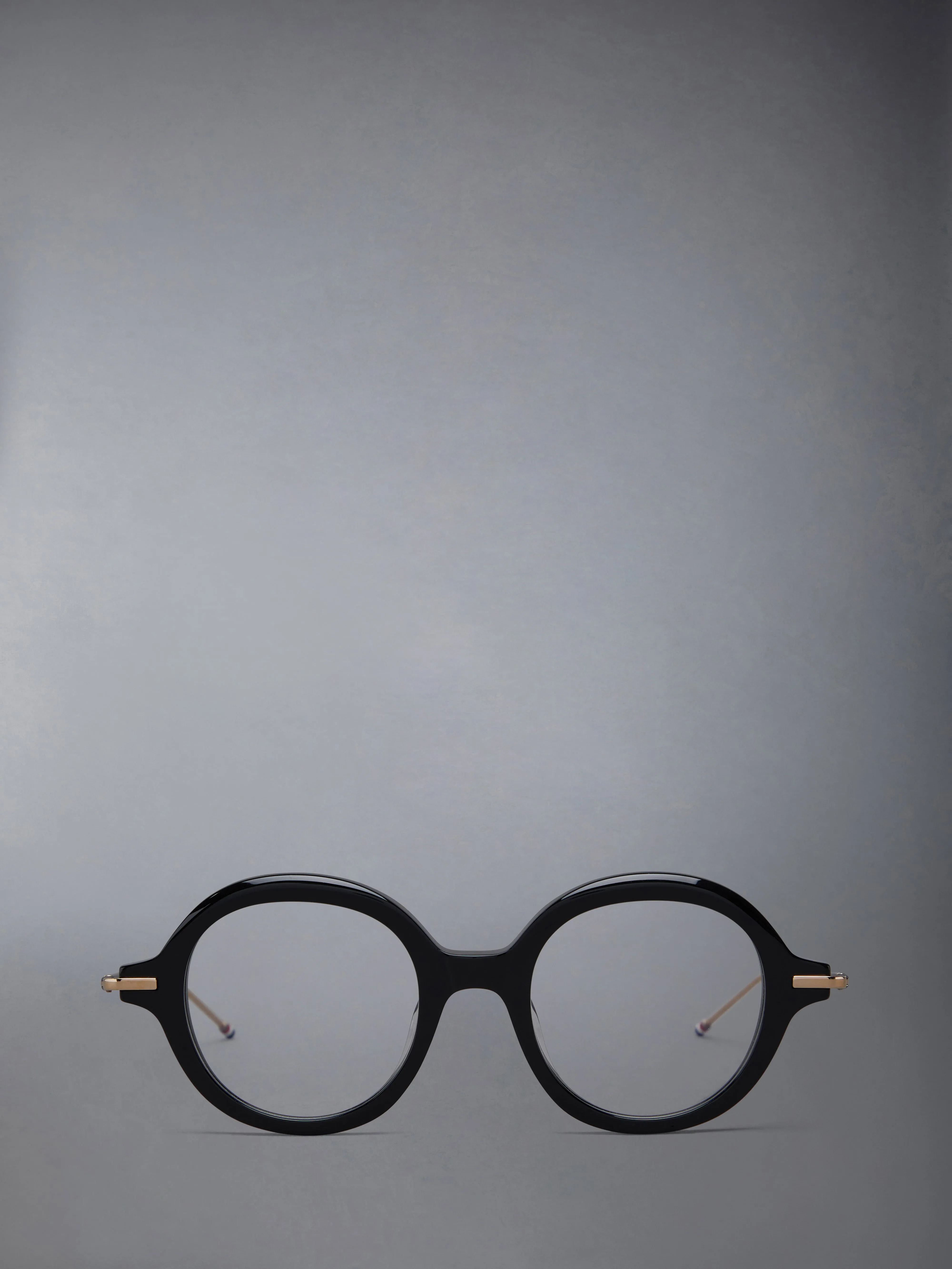 ACETATE AND TITANIUM ROUND EYEGLASSES sold by Thom Browne