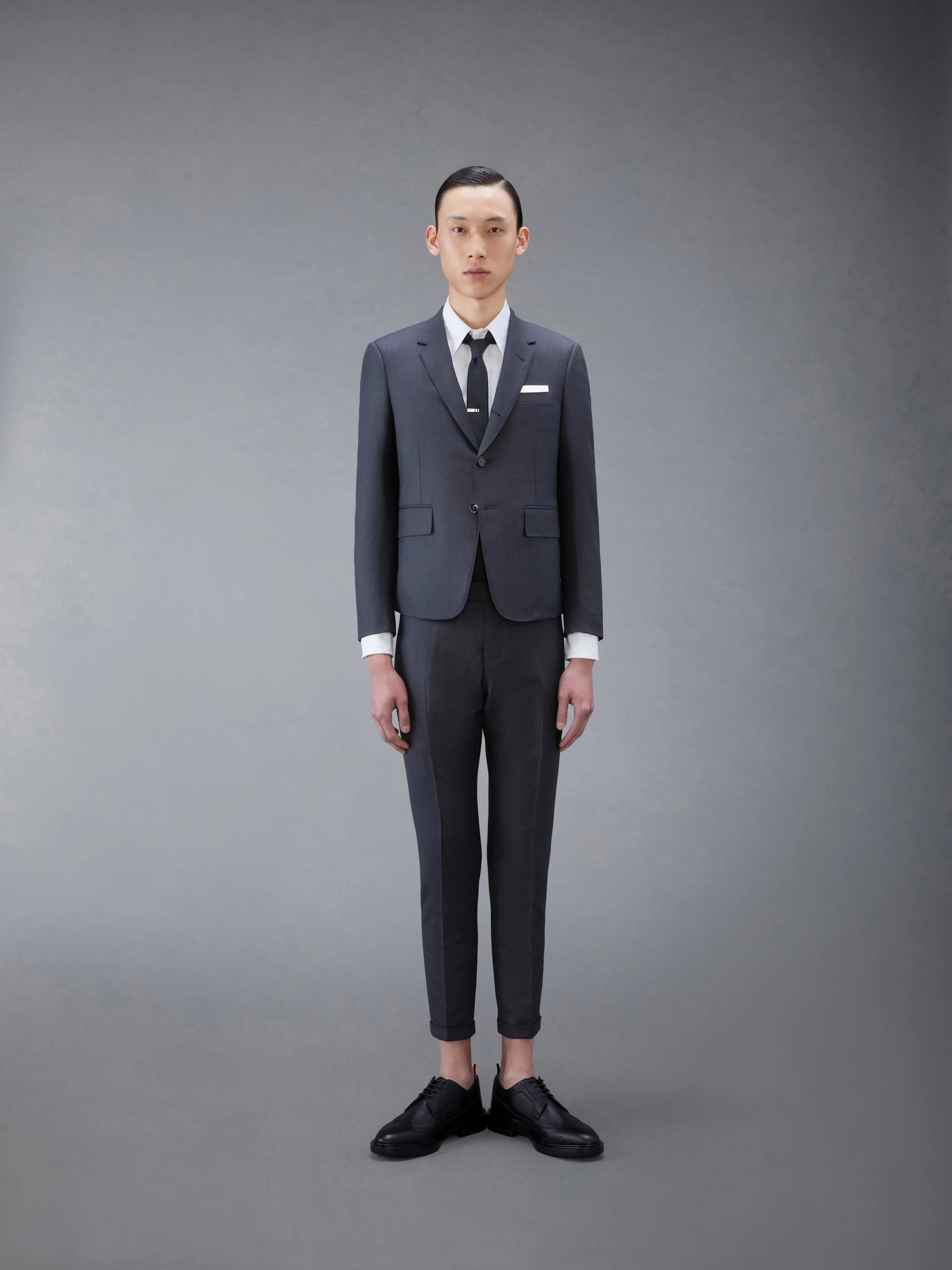 TWILL HIGH ARMHOLE SUIT AND TIE sold by Thom Browne