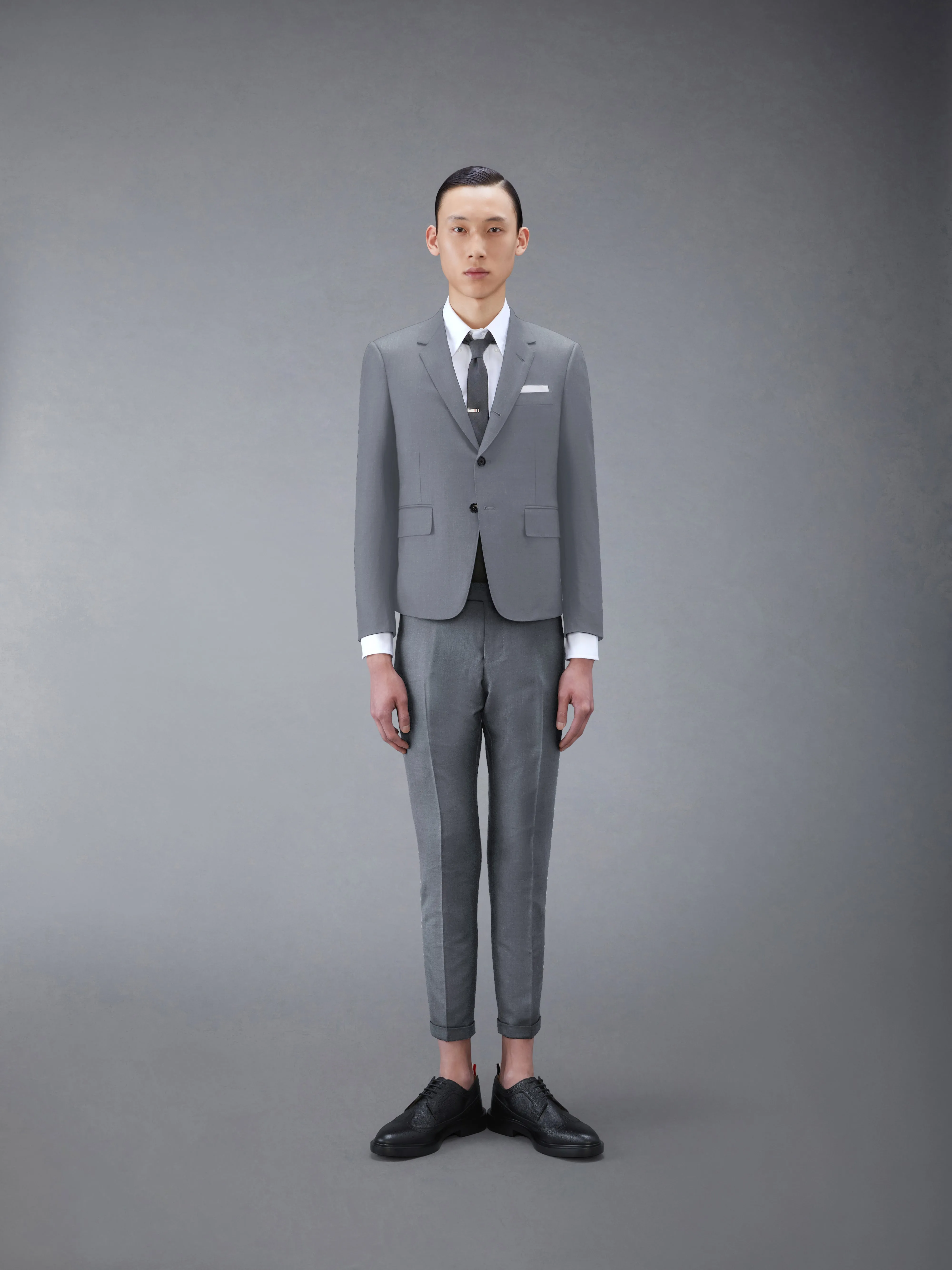 TWILL HIGH ARMHOLE SUIT AND TIE sold by Thom Browne