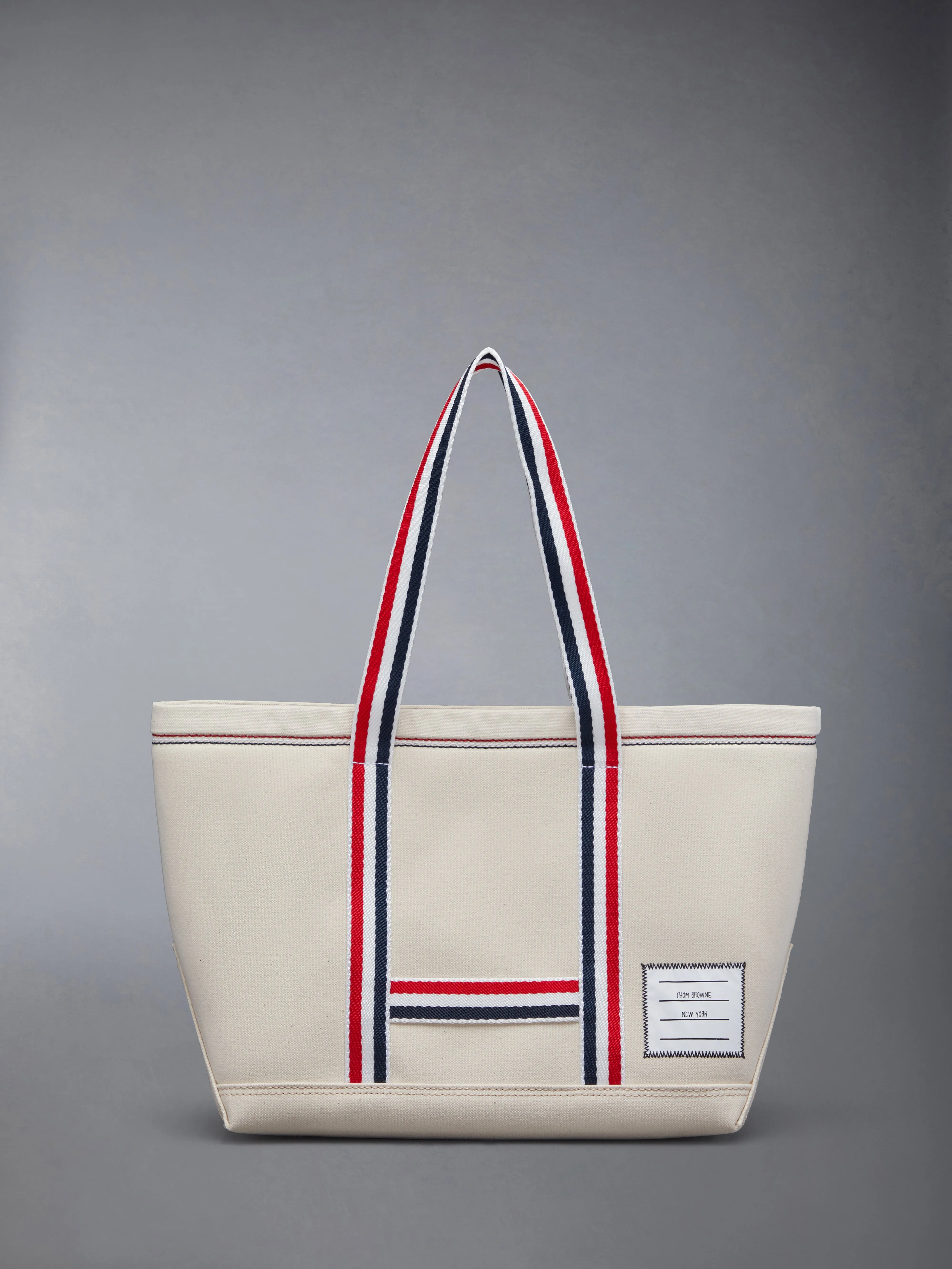 DOUBLE FACE CANVAS SMALL TOOL TOTE sold by Thom Browne