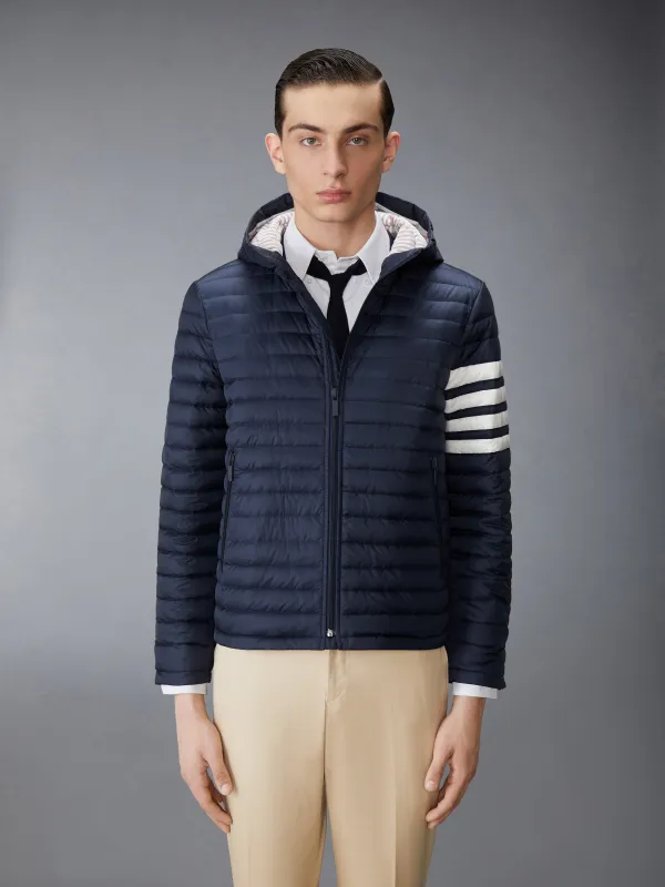 MATTE FINISH NYLON DOWN FILL QUILTED 4-BAR HOOD JACKET sold by Thom Browne
