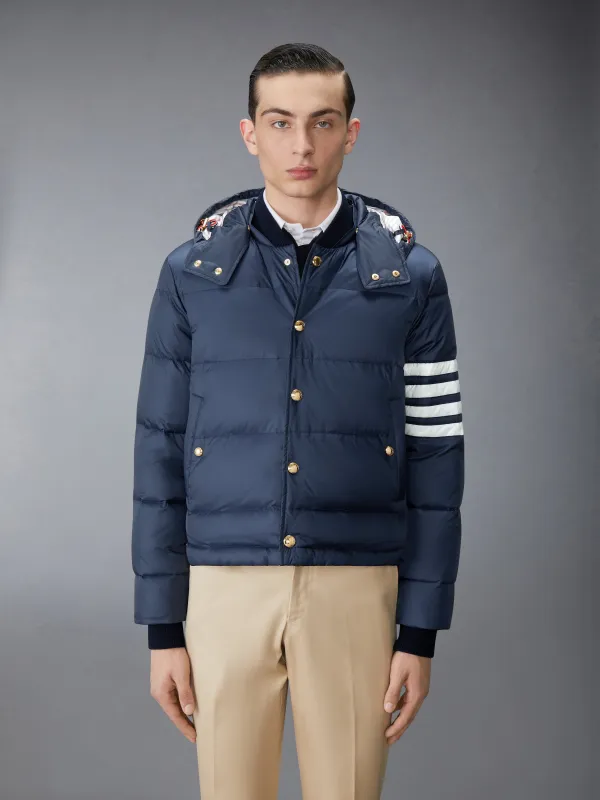 MATTE FINISH NYLON DOWN FILL 4-BAR HOOD BOMBER sold by Thom Browne