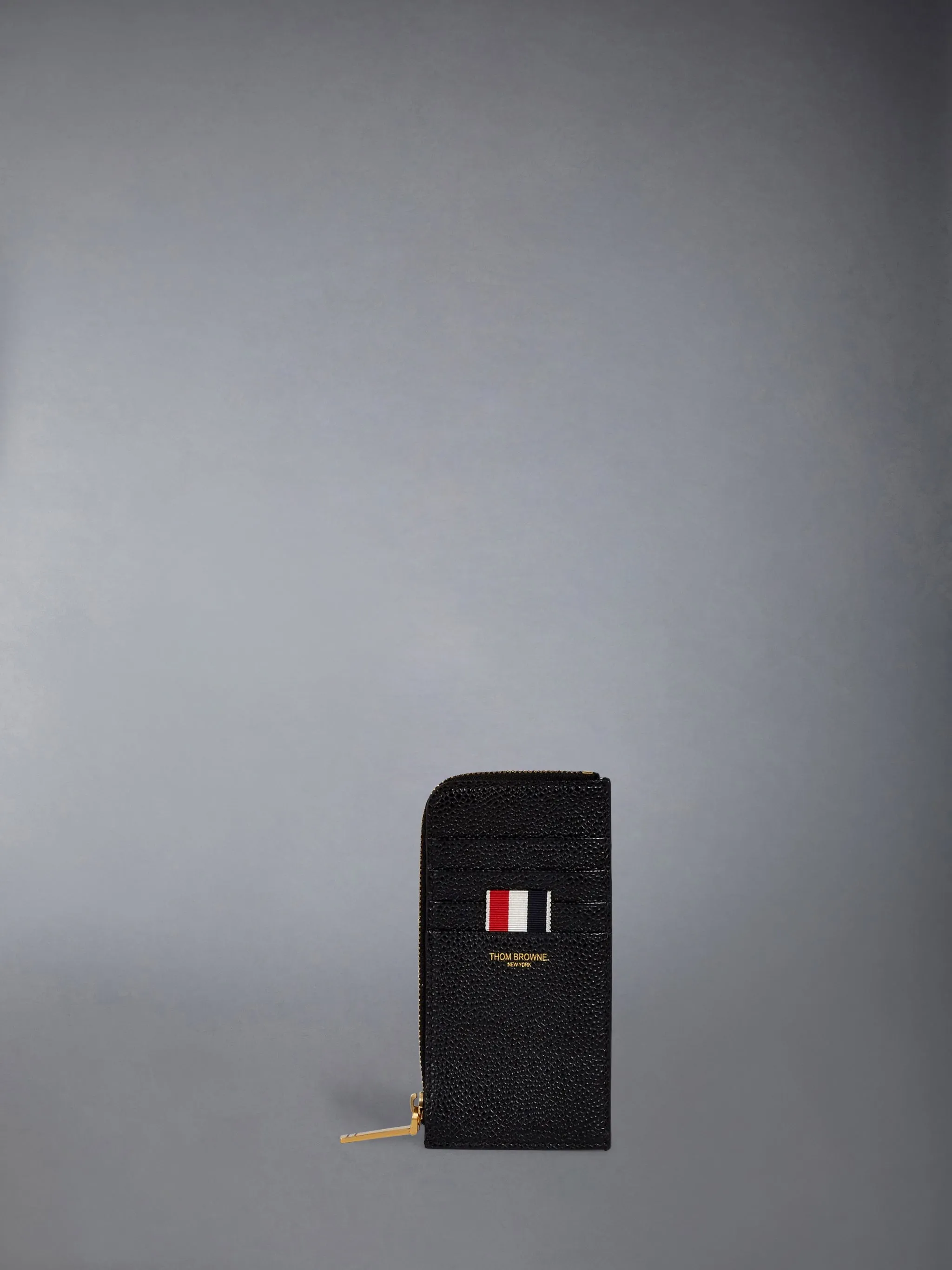 PEBBLE GRAIN HALF ZIP AROUND WALLET sold by Thom Browne