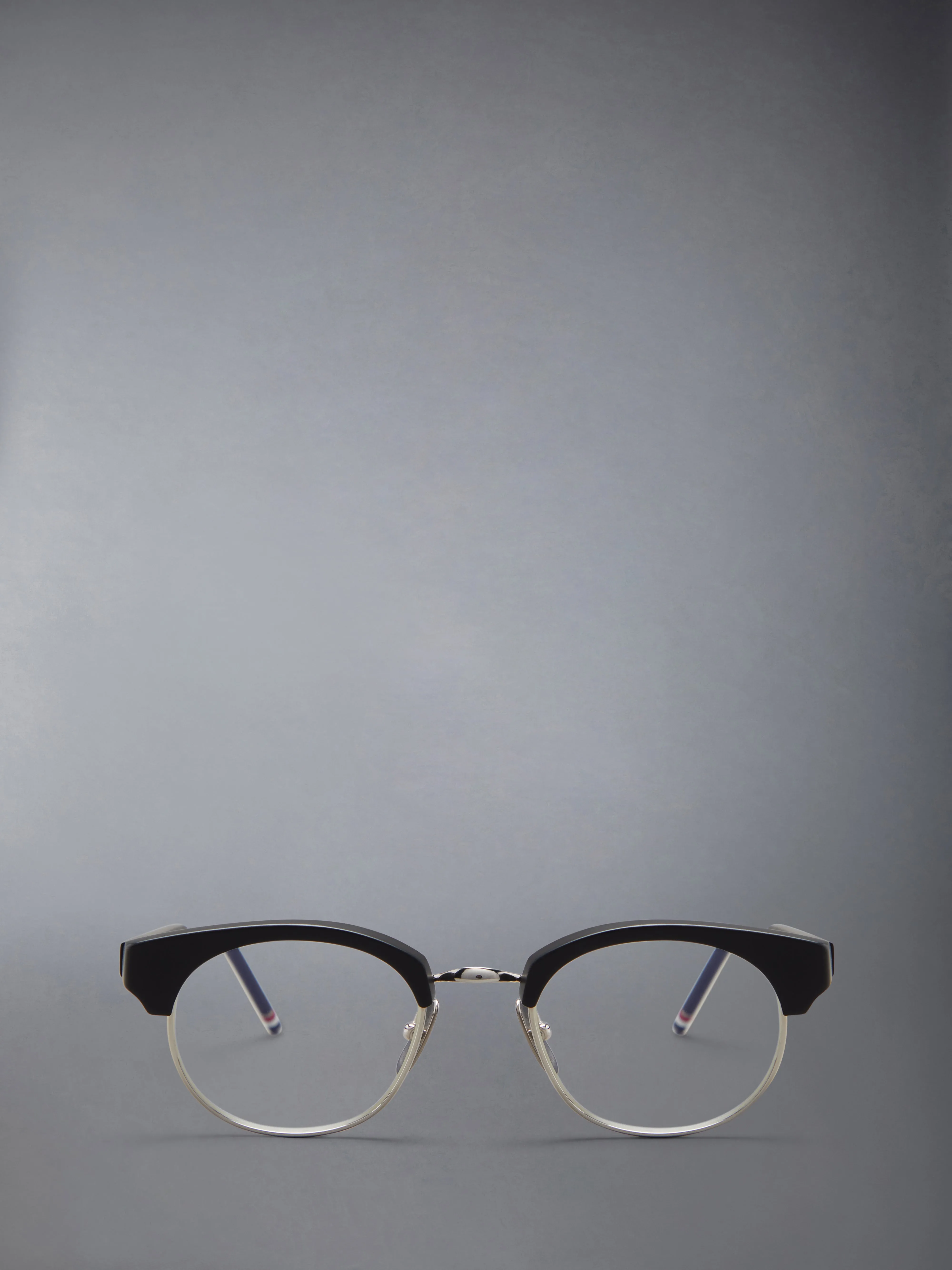 ACETATE AND TITANIUM OVAL EYEGLASSES sold by Thom Browne