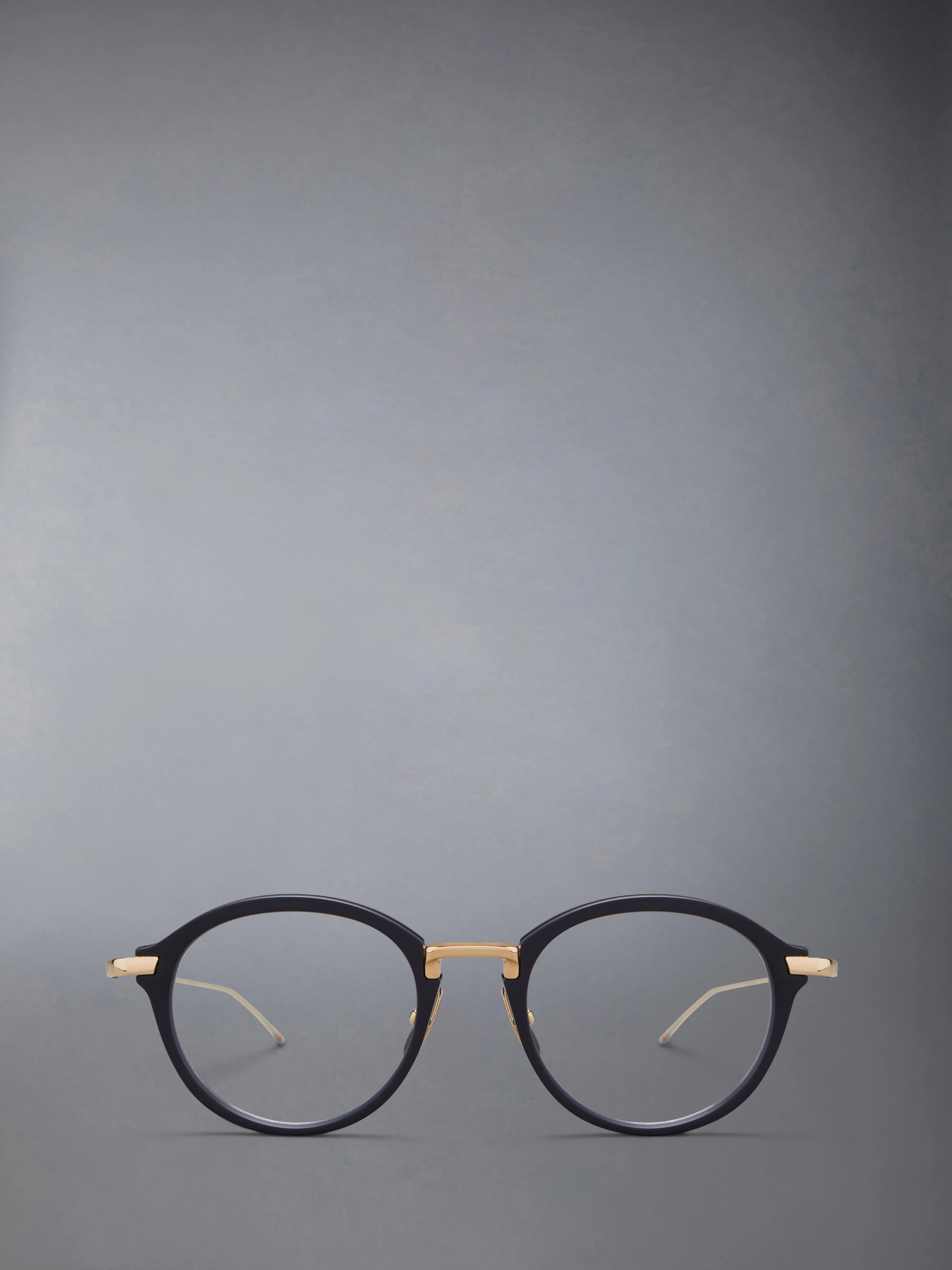 ACETATE AND TITANIUM ROUND EYEGLASSES sold by Thom Browne