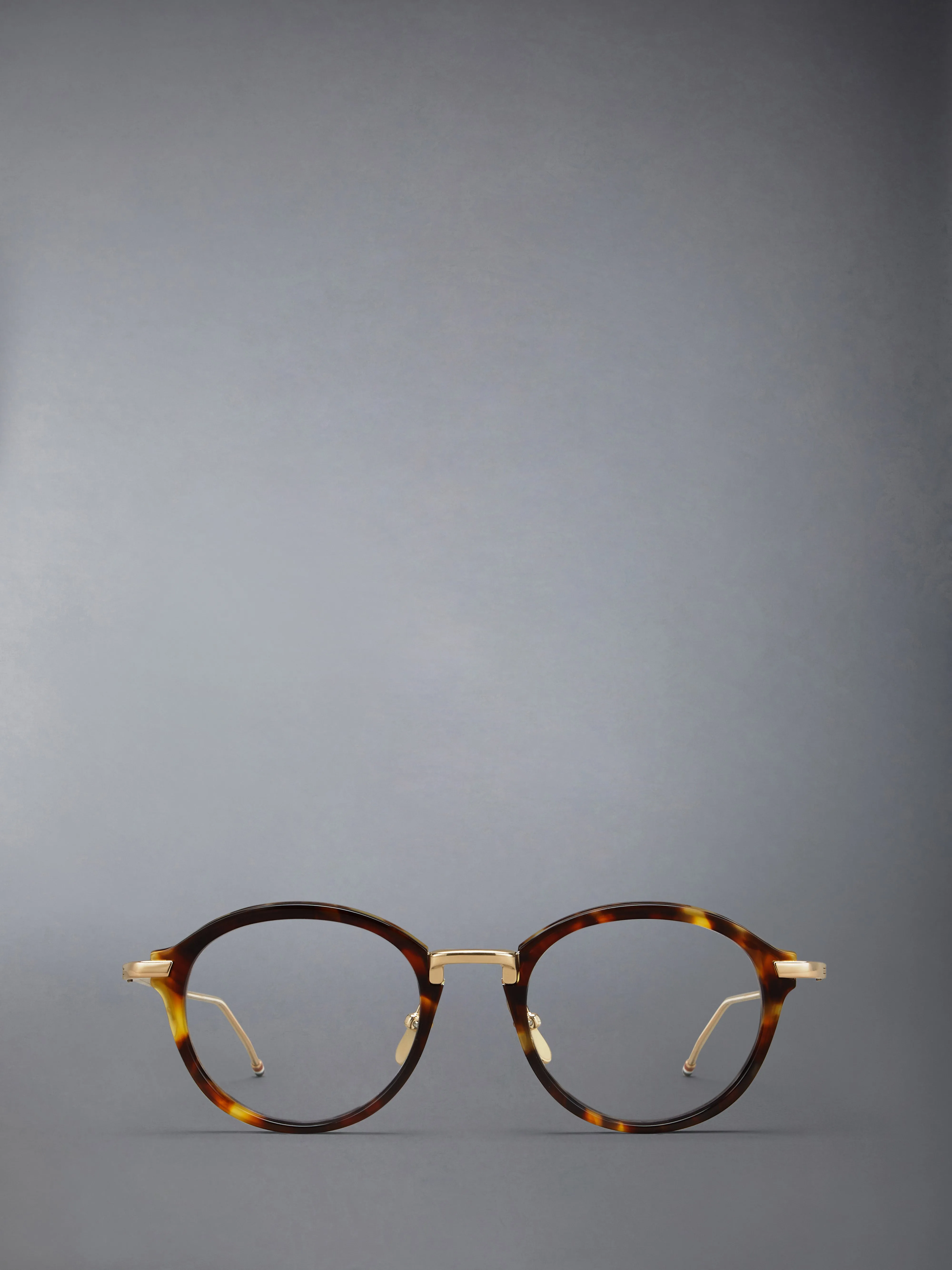 ACETATE AND TITANIUM ROUND EYEGLASSES sold by Thom Browne