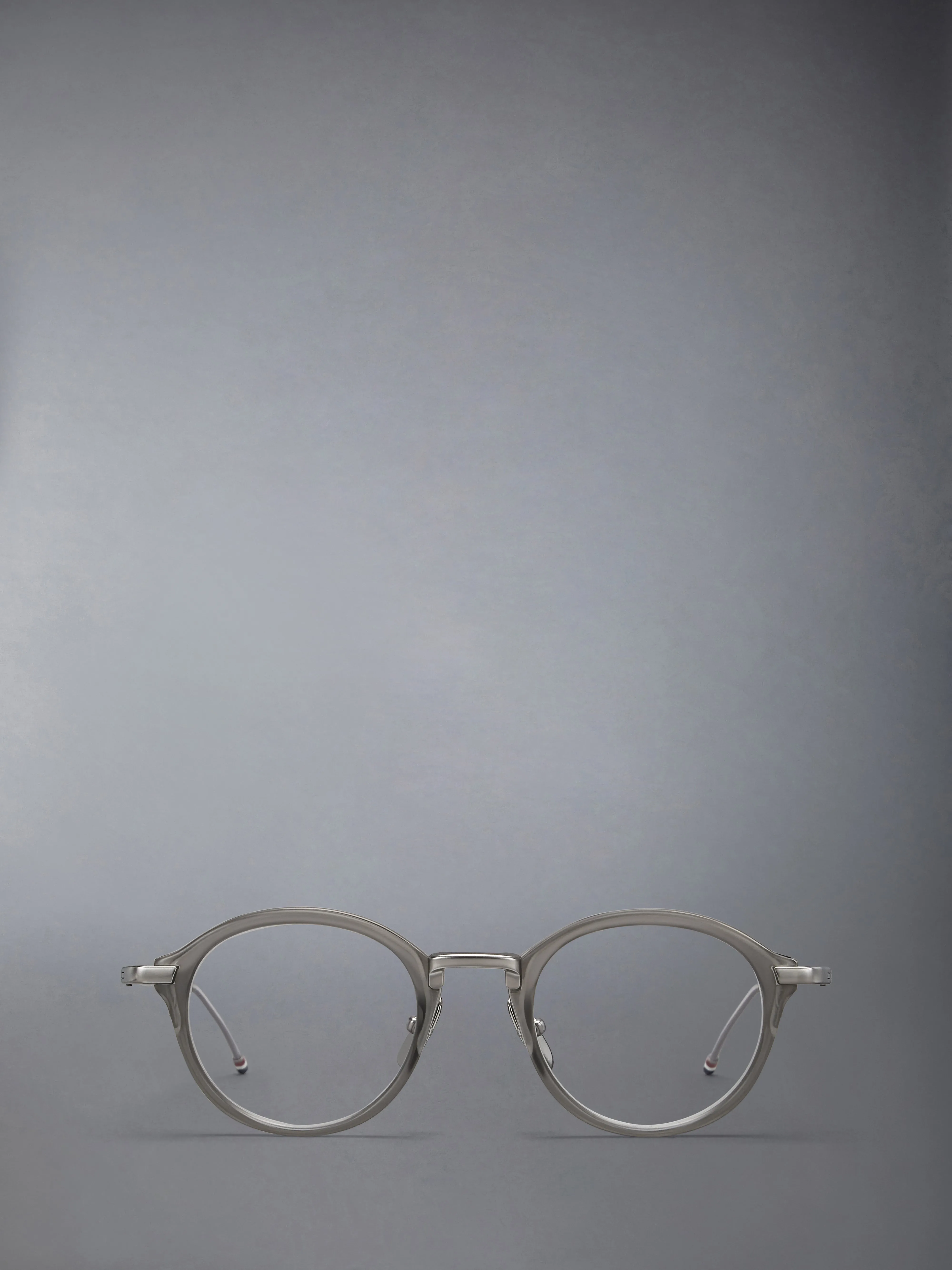 ACETATE AND TITANIUM ROUND EYEGLASSES sold by Thom Browne