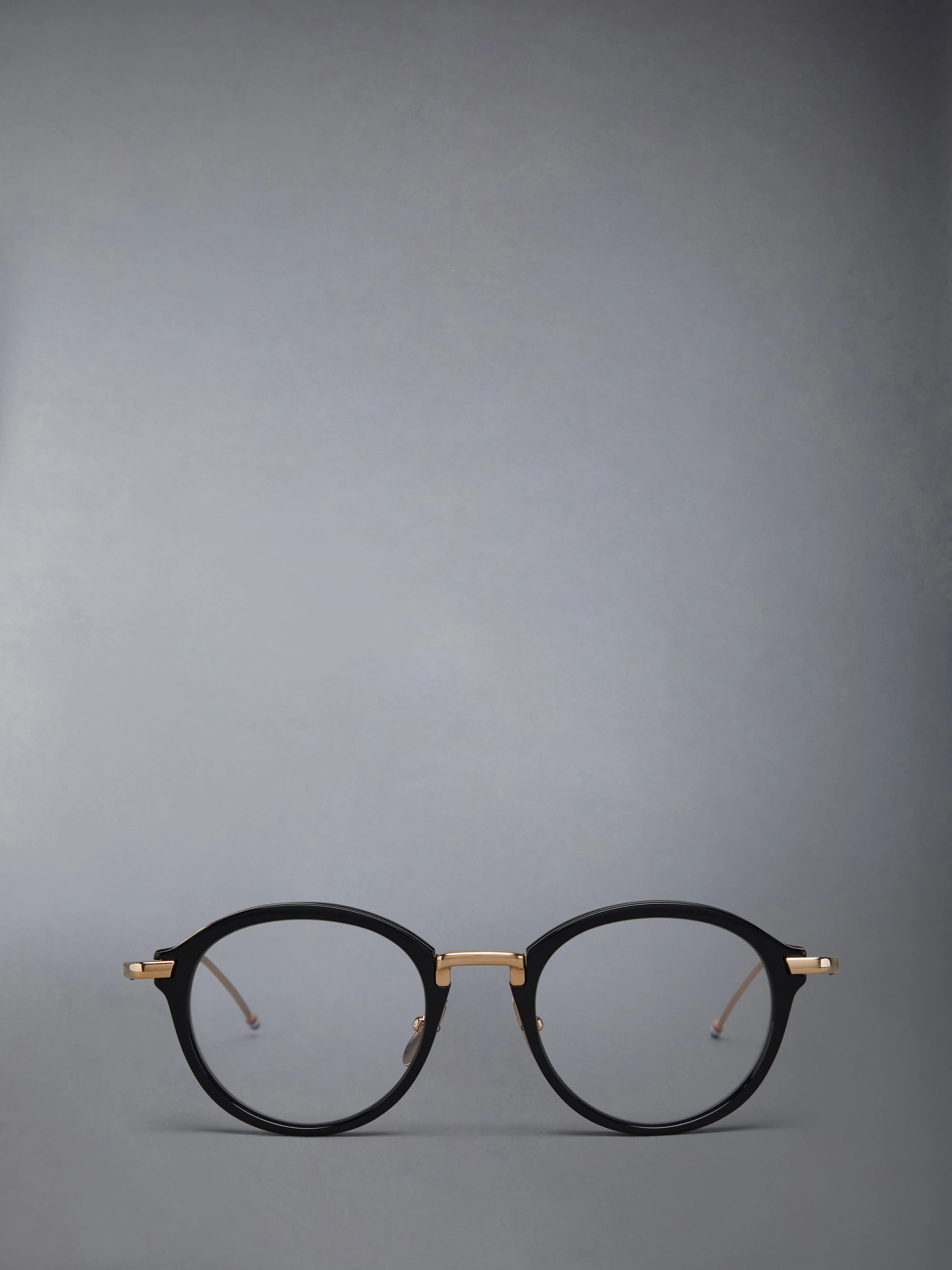 ACETATE AND TITANIUM ROUND EYEGLASSES sold by Thom Browne