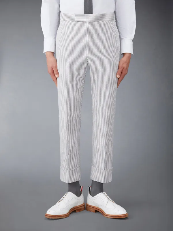 CLASSIC SEERSUCKER BACKSTRAP TROUSERS sold by Thom Browne