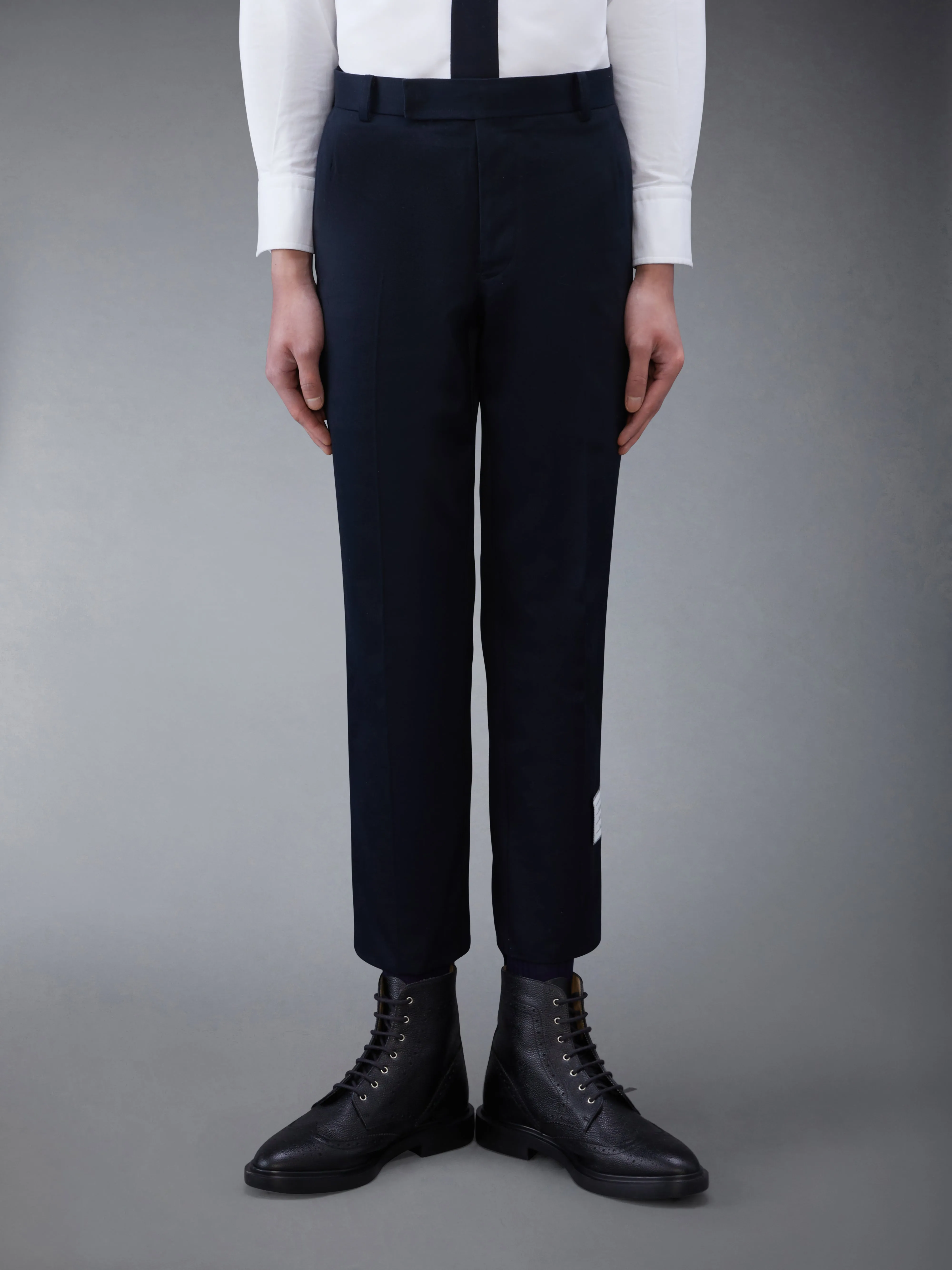 COTTON TWILL CHINO TROUSERS sold by Thom Browne