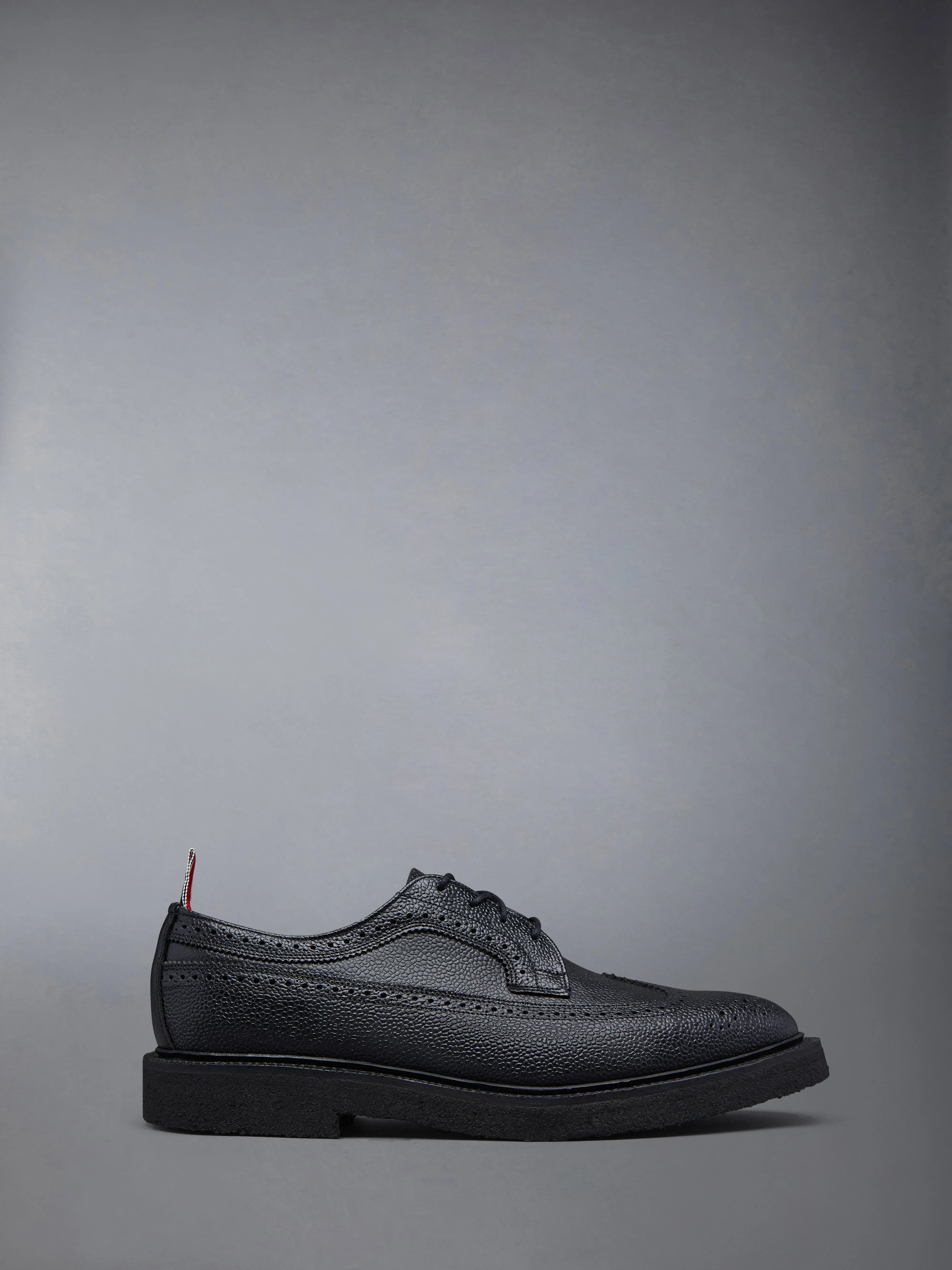 CREPE SOLE LONGWING BROGUE sold by Thom Browne