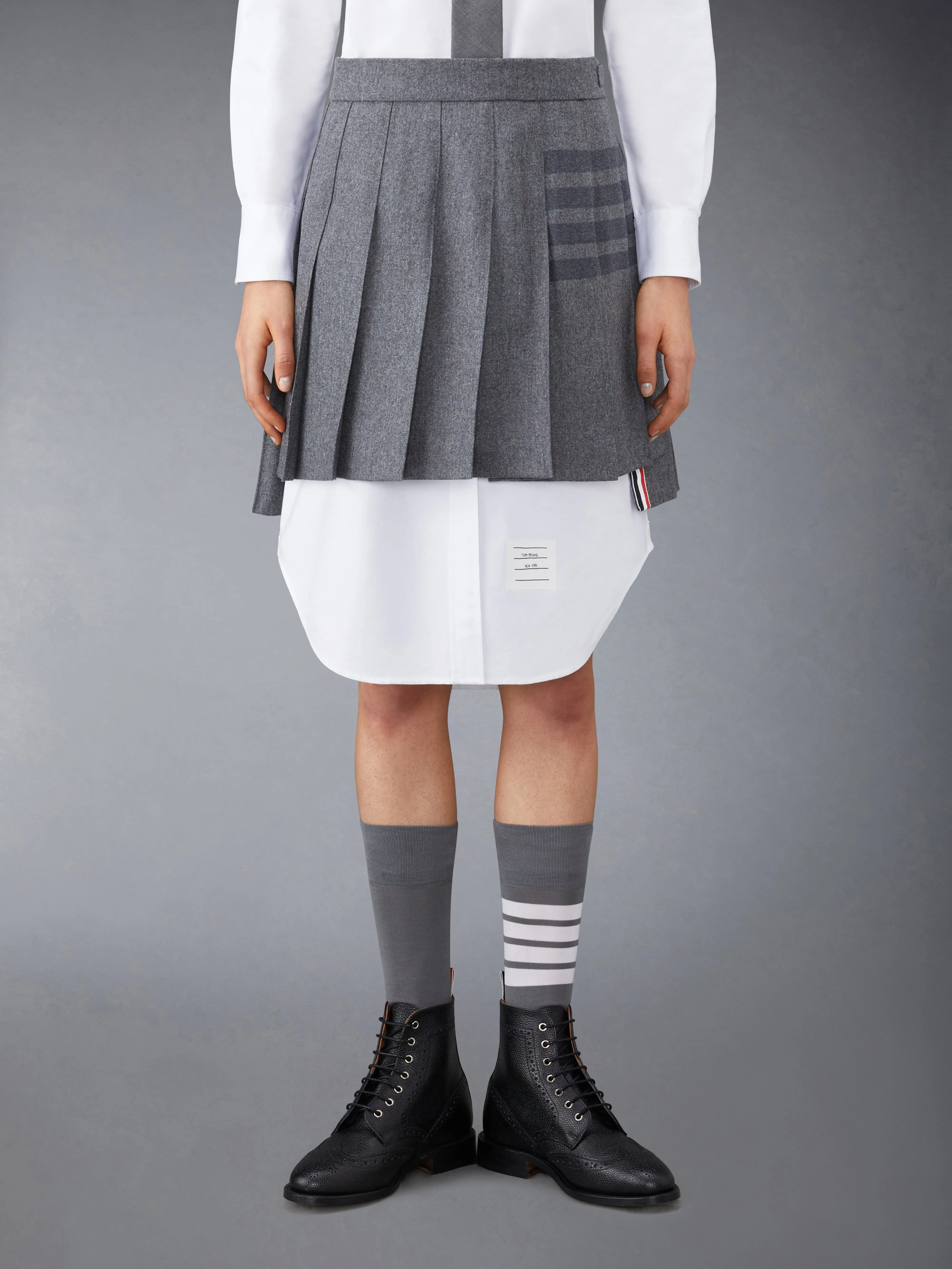 FLANNEL 4-BAR MINI PLEATED SKIRT sold by Thom Browne