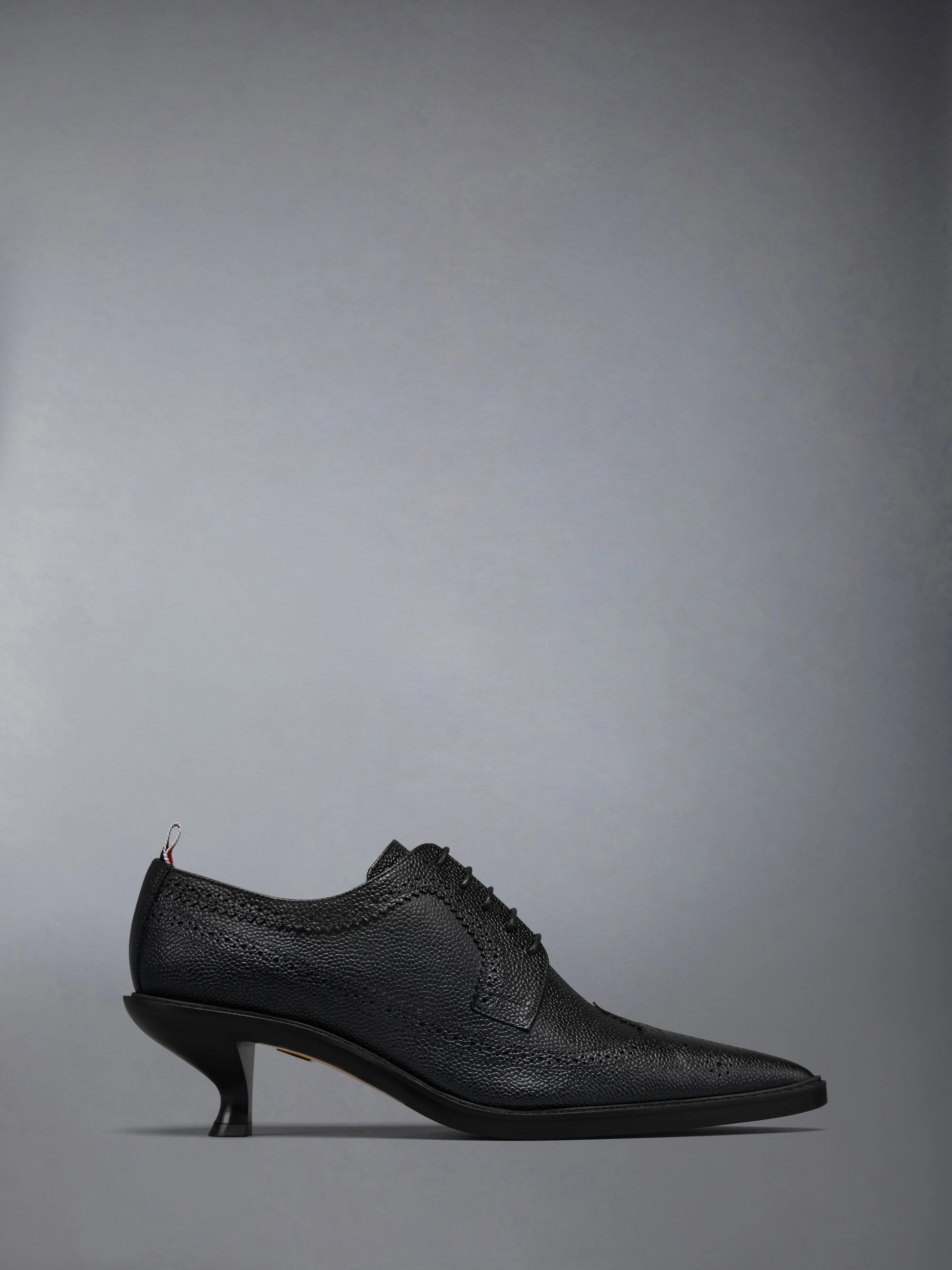 LEATHER SOLE HEELED LONGWING BROGUE sold by Thom Browne