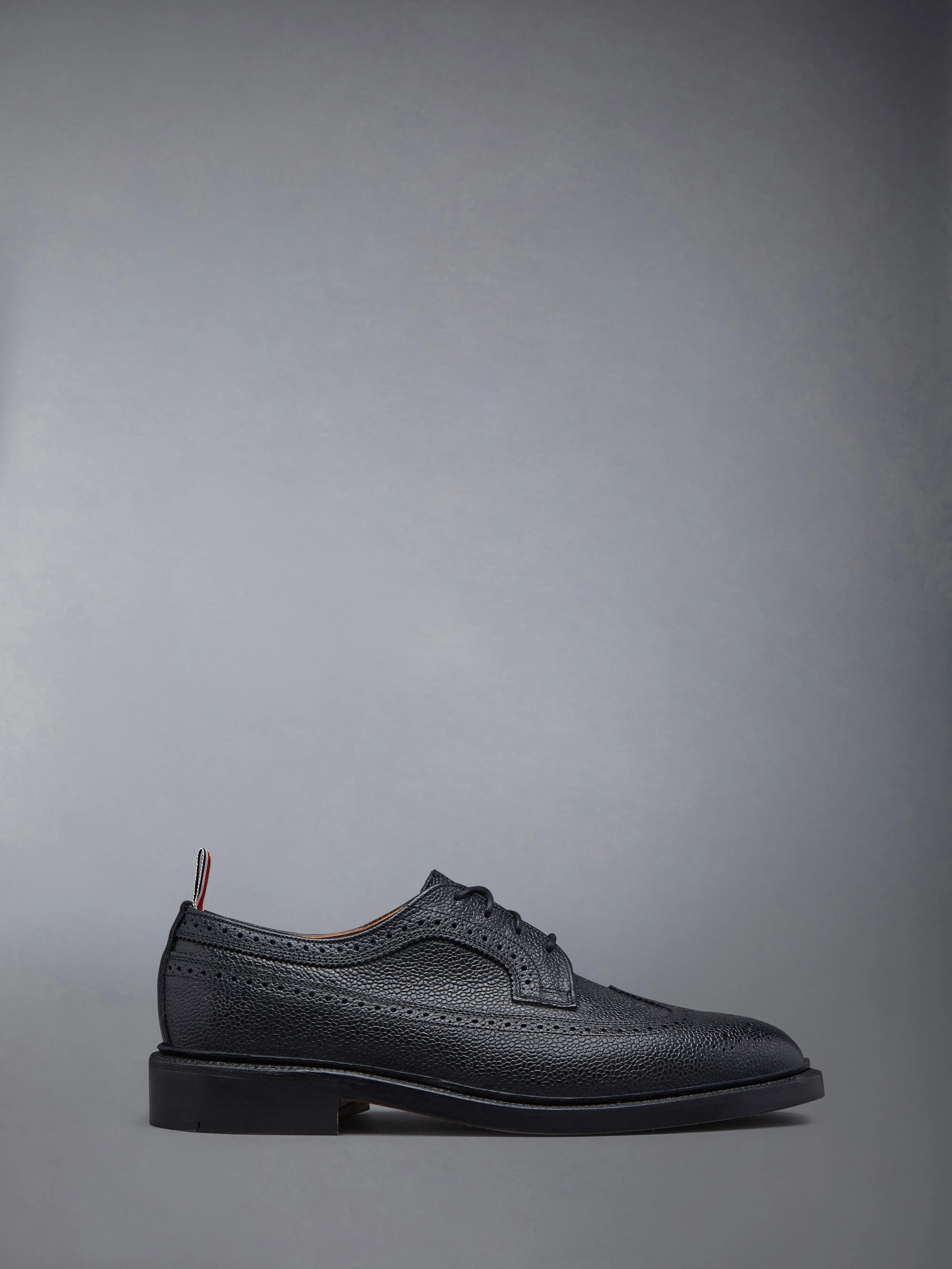 LEATHER SOLE LONGWING BROGUE sold by Thom Browne