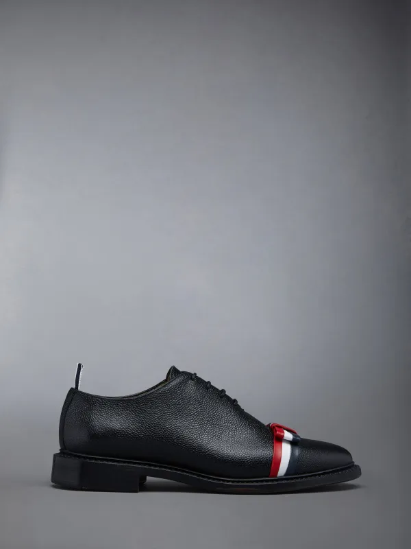 PEBBLE GRAIN BOW WHOLECUT SHOE sold by Thom Browne
