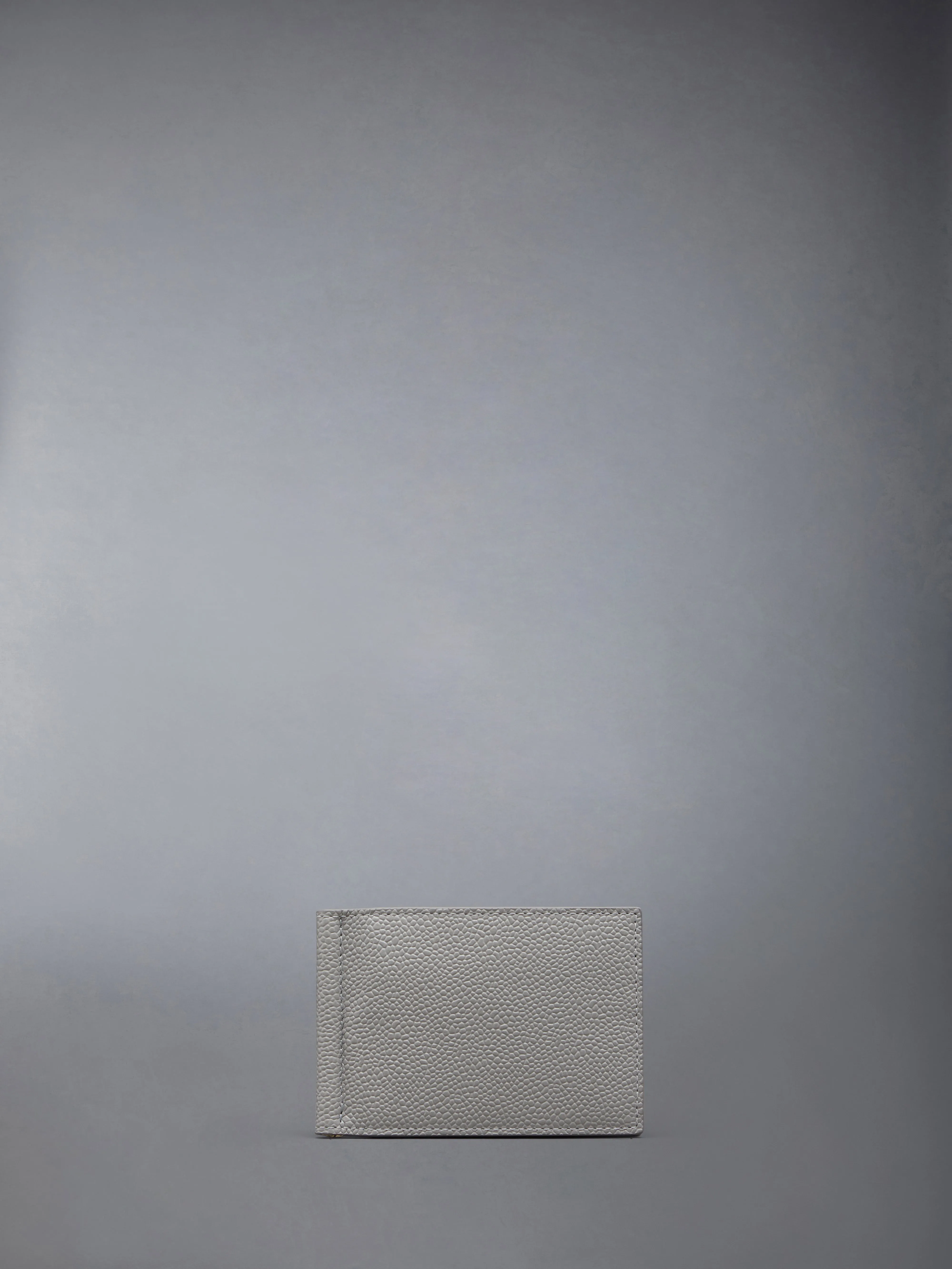 PEBBLE GRAIN LEATHER MONEY CLIP WALLET sold by Thom Browne