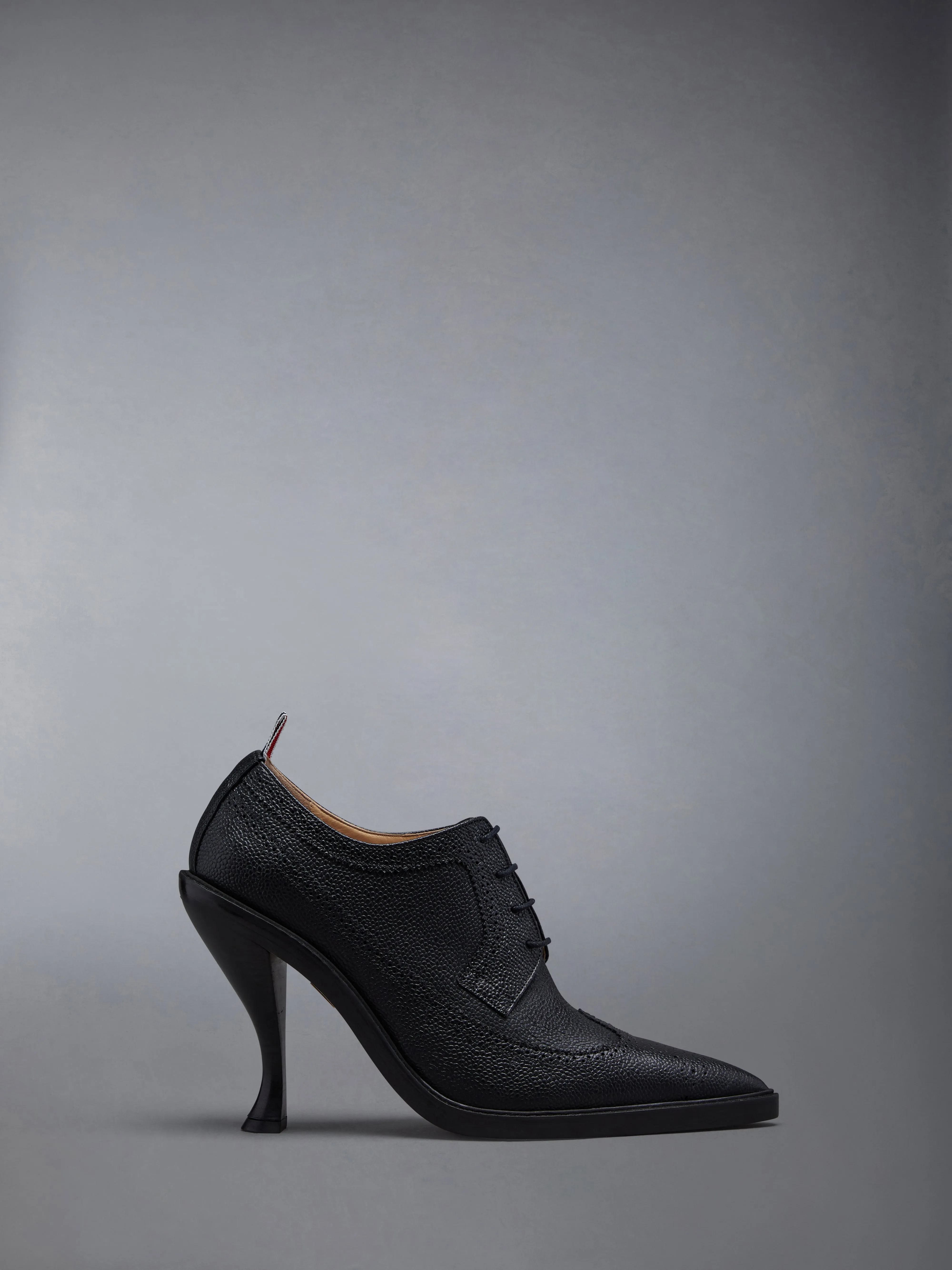 PEBBLE GRAIN LEATHER SOLE HEELED LONGWING BROGUE sold by Thom Browne