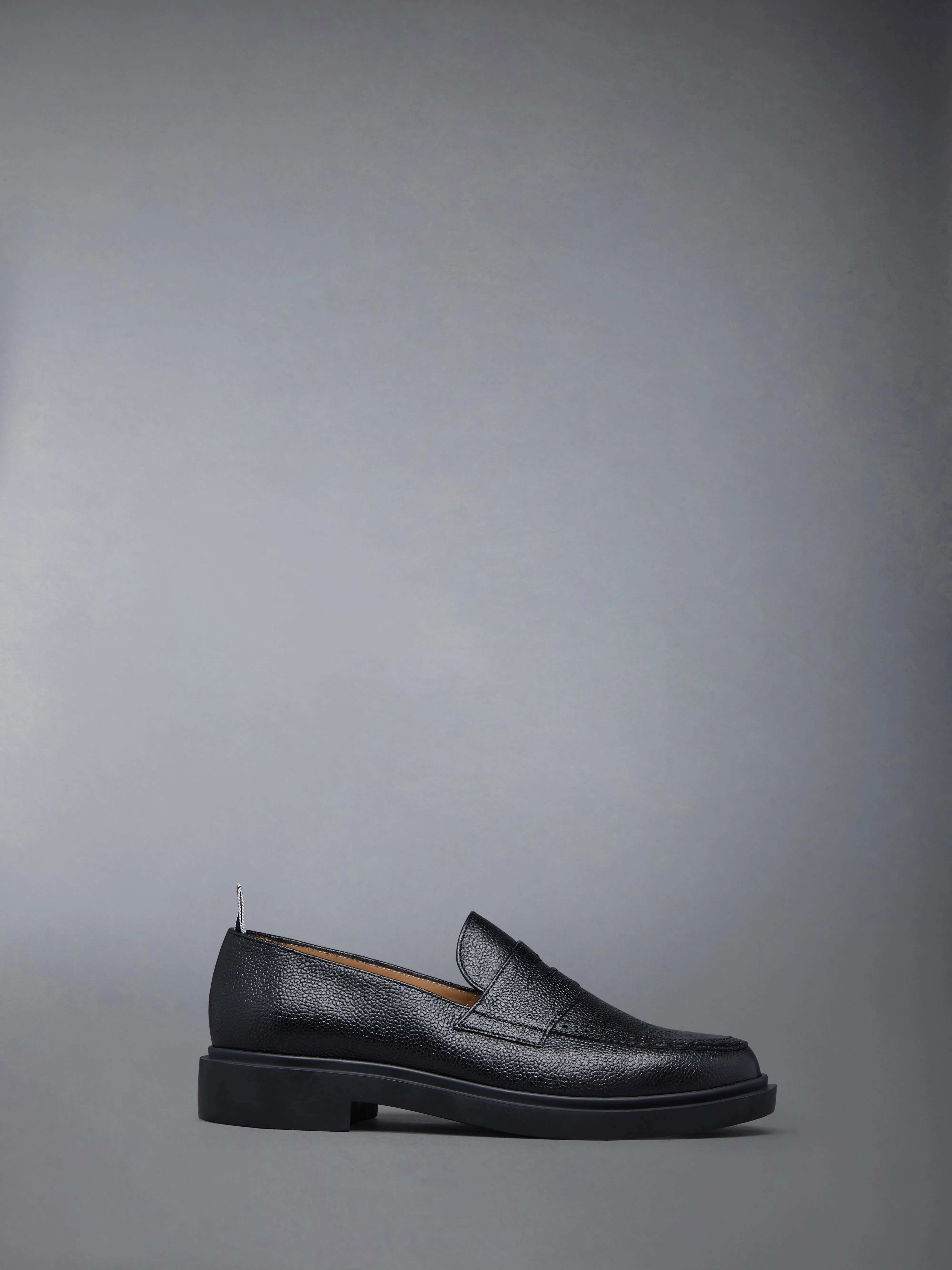 PEBBLE GRAIN RUBBER SOLE PENNY LOAFER sold by Thom Browne