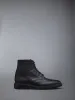 PEBBLE GRAIN WINGTIP BOOT sold by Thom Browne