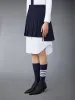 SCHOOL UNIFORM PLAIN WEAVE MINI PLEATED SKIRT sold by Thom Browne